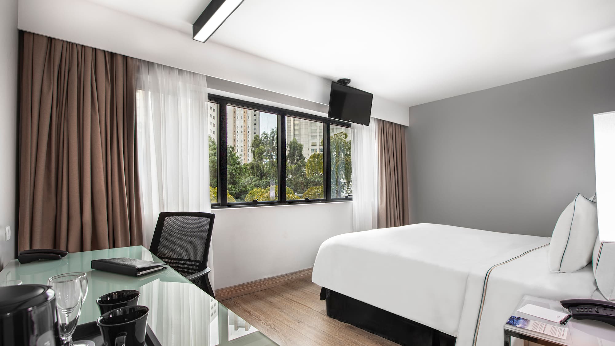 a room with a bed and a desk