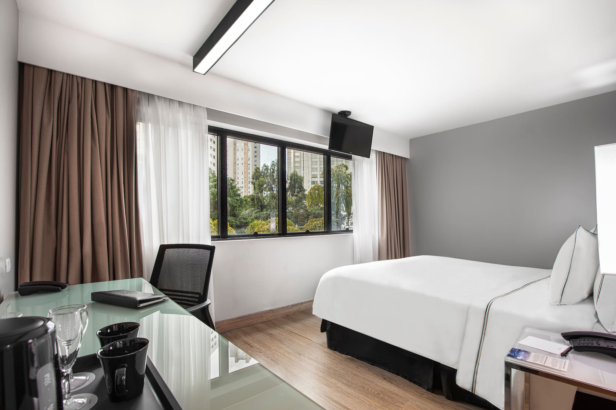 a room with a bed and a desk