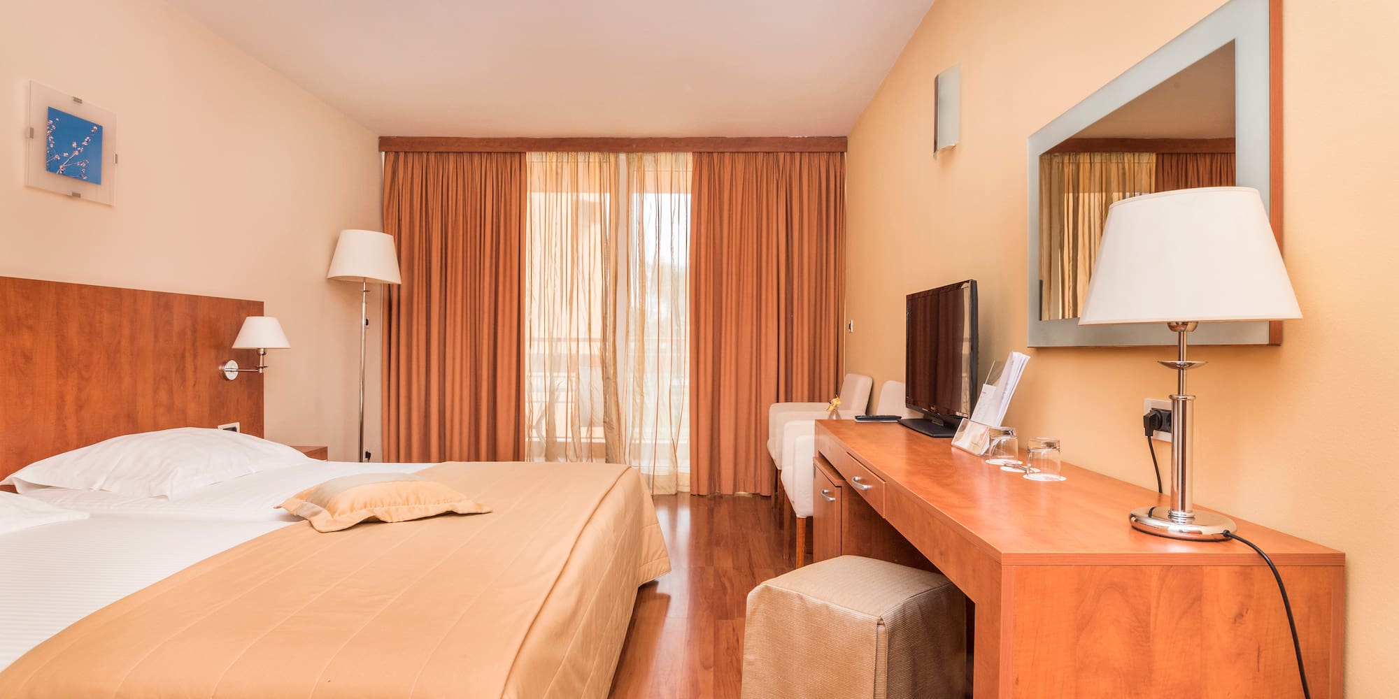 a bedroom with a bed and a desk