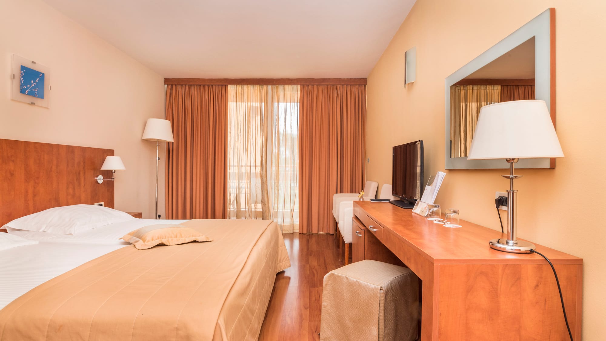a bedroom with a bed and a desk