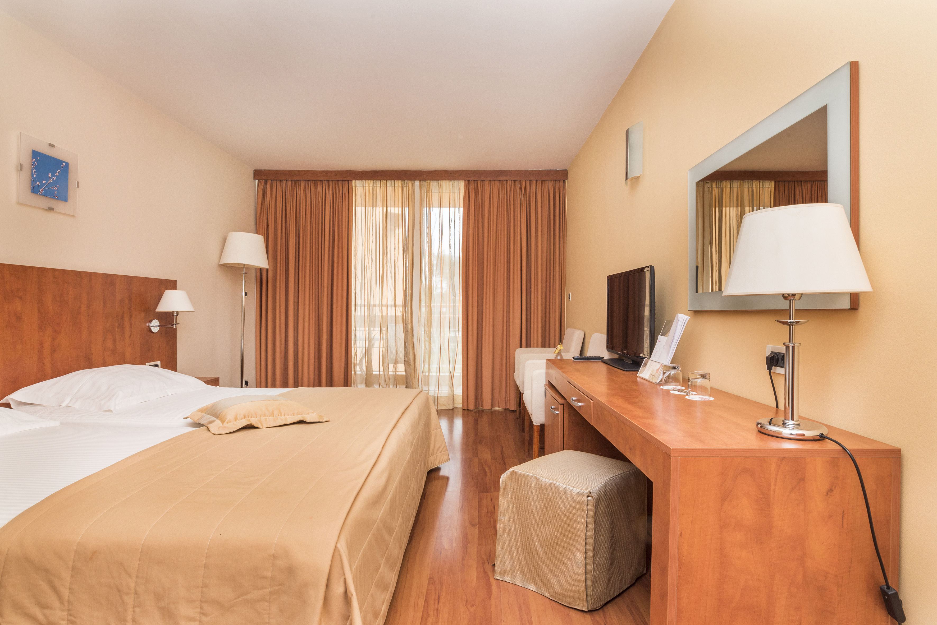 a bedroom with a bed and a desk