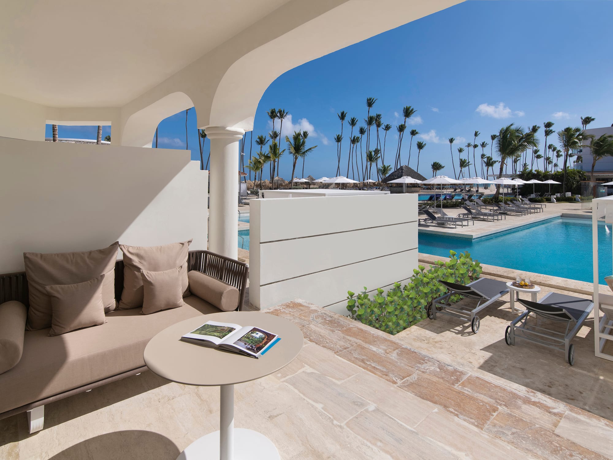 a pool with a couch and a table