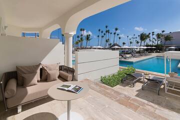 a pool with a couch and a table