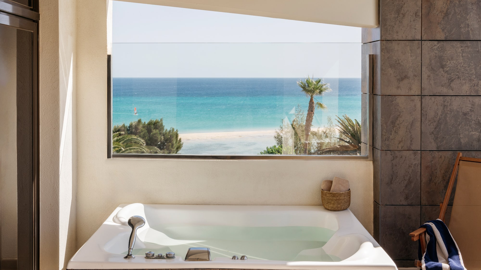 a bathtub with a view of the ocean