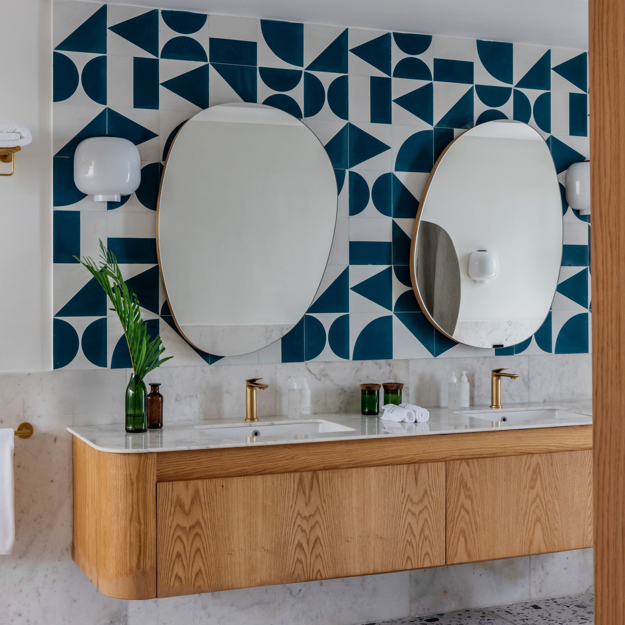 a bathroom with a mirror and a wall