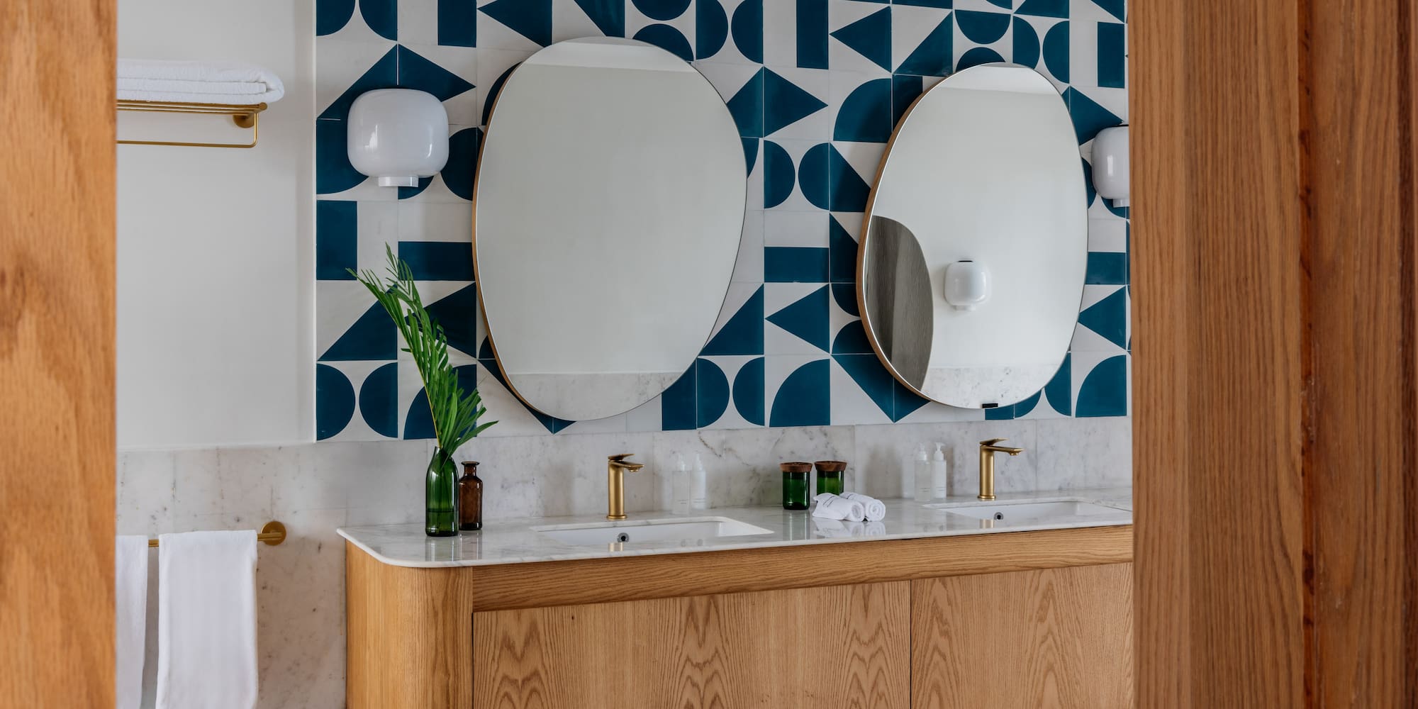 a bathroom with a mirror and a wall