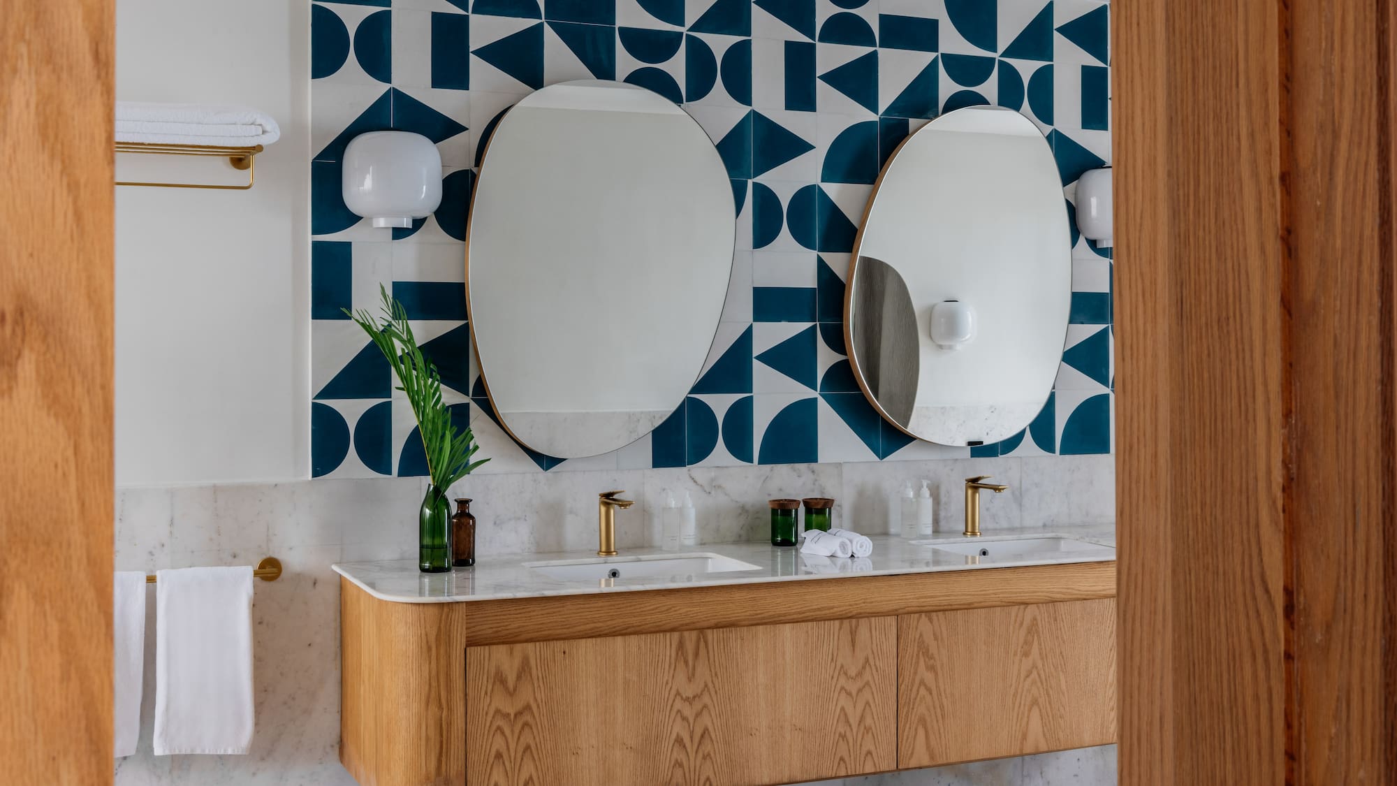 a bathroom with a mirror and a wall