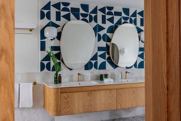 a bathroom with a mirror and a wall