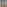 Modern double vanity, wood cabinet, marble counter, gold faucets, blue geometric tiles.