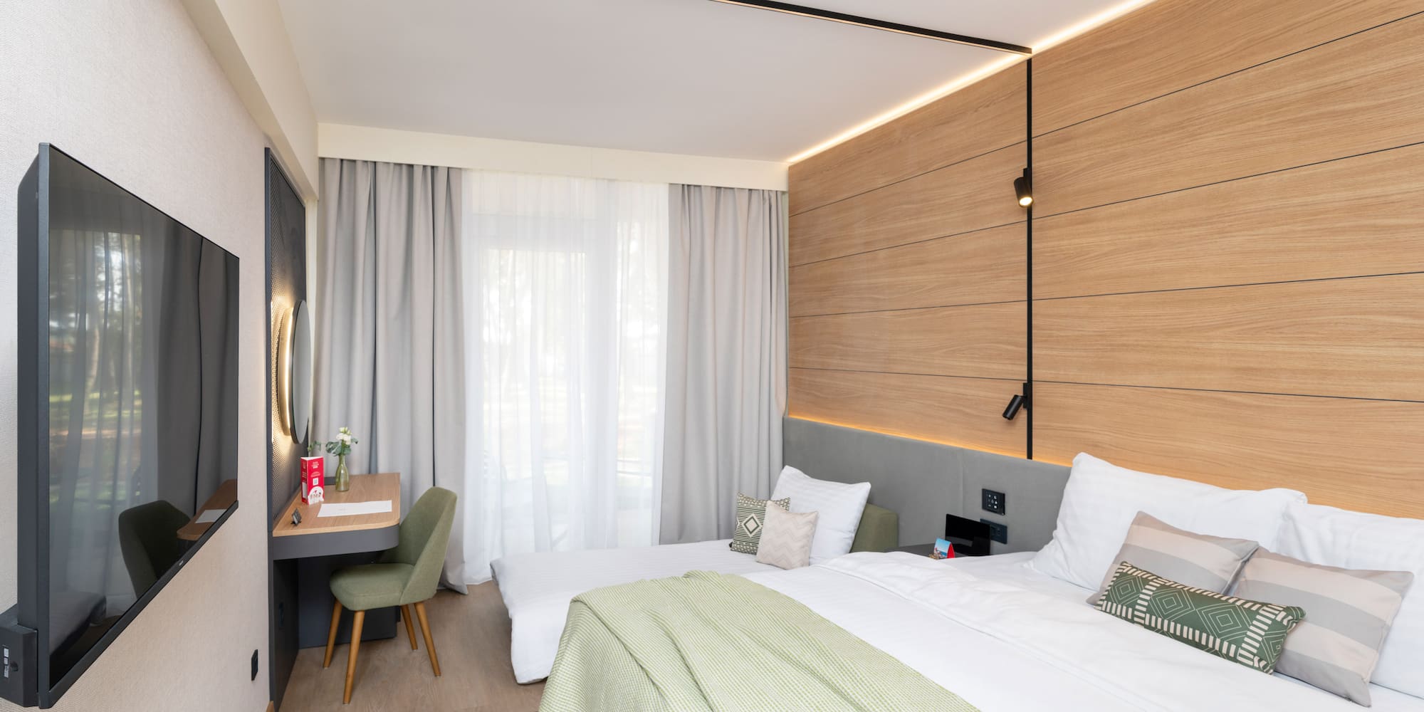 a room with a bed and desk