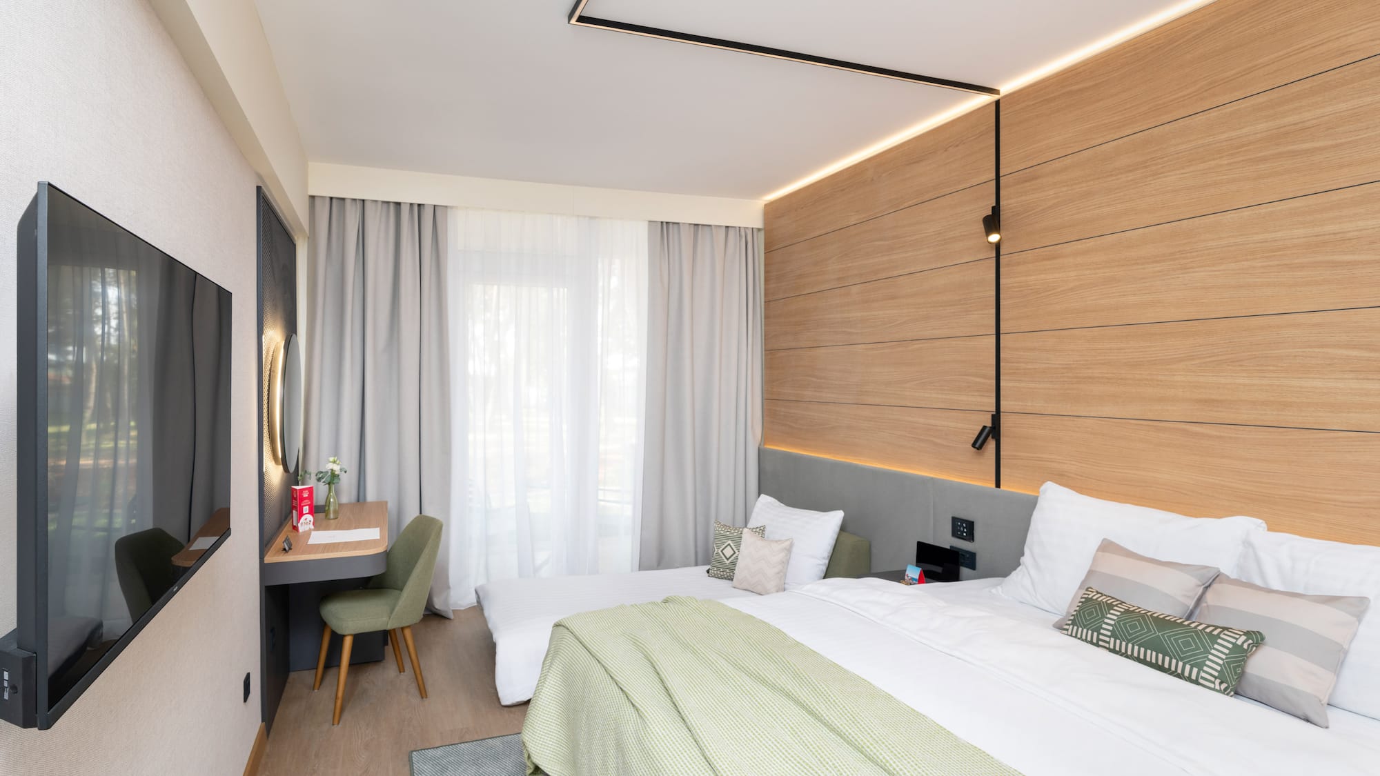 a room with a bed and desk