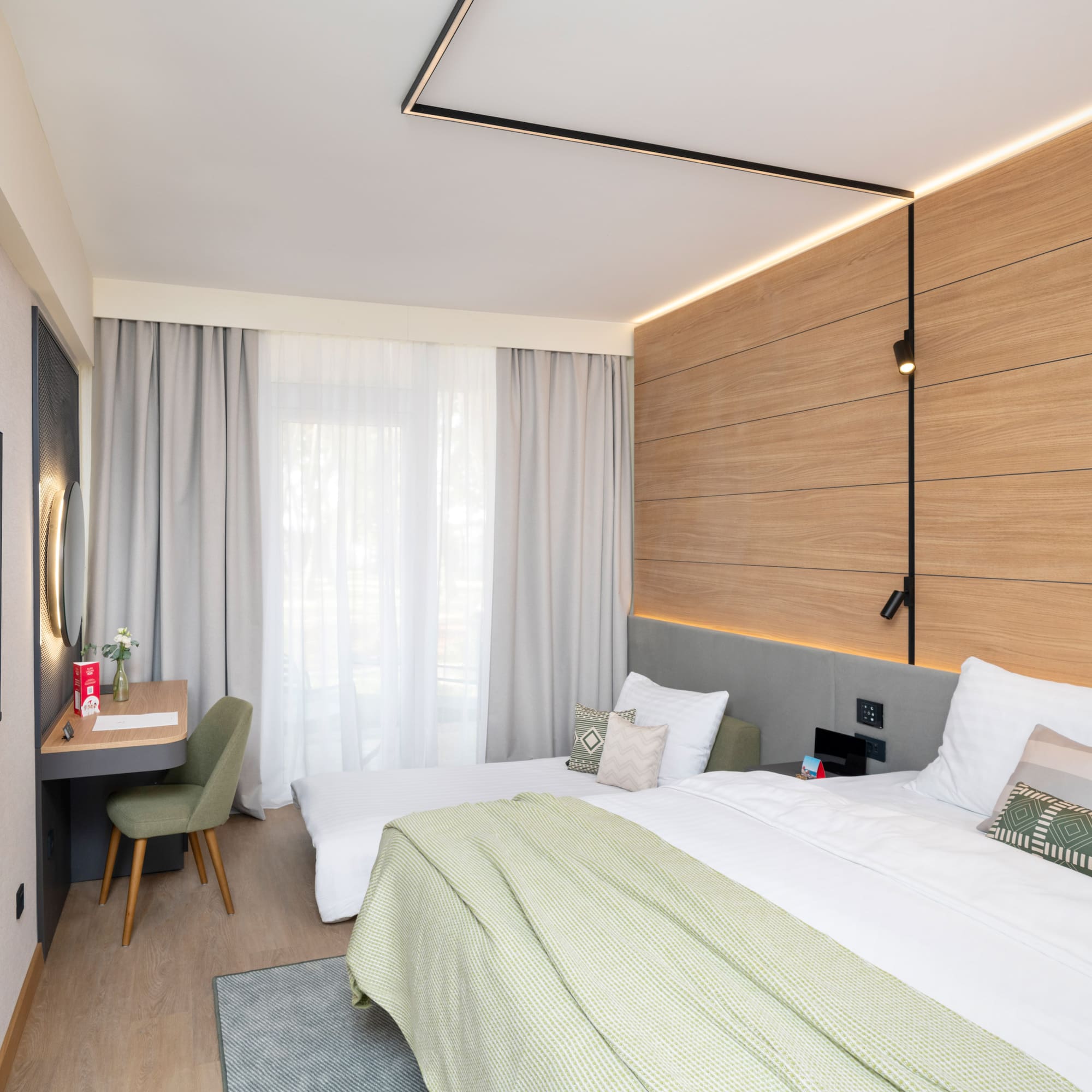 a room with a bed and desk