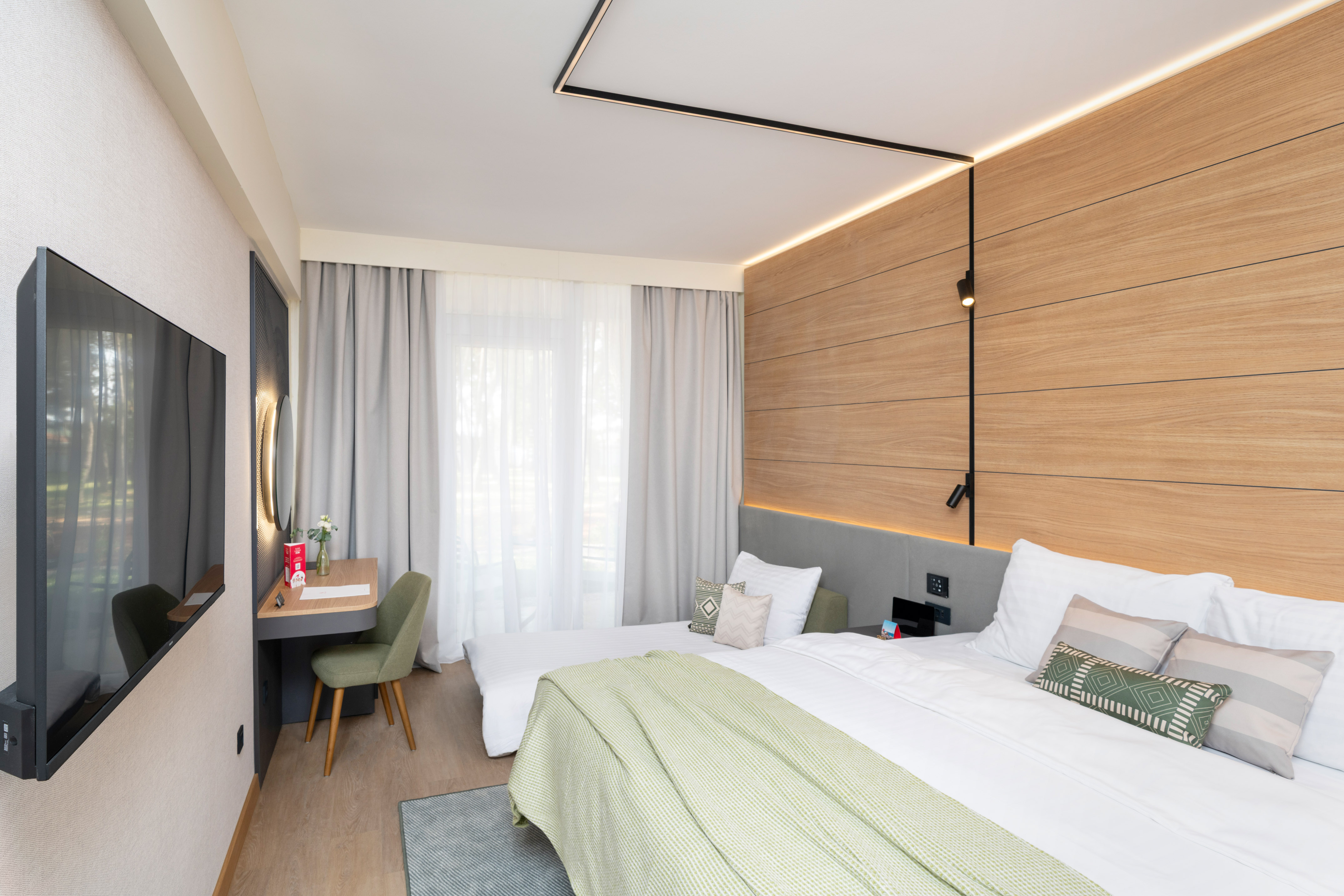 a room with a bed and desk