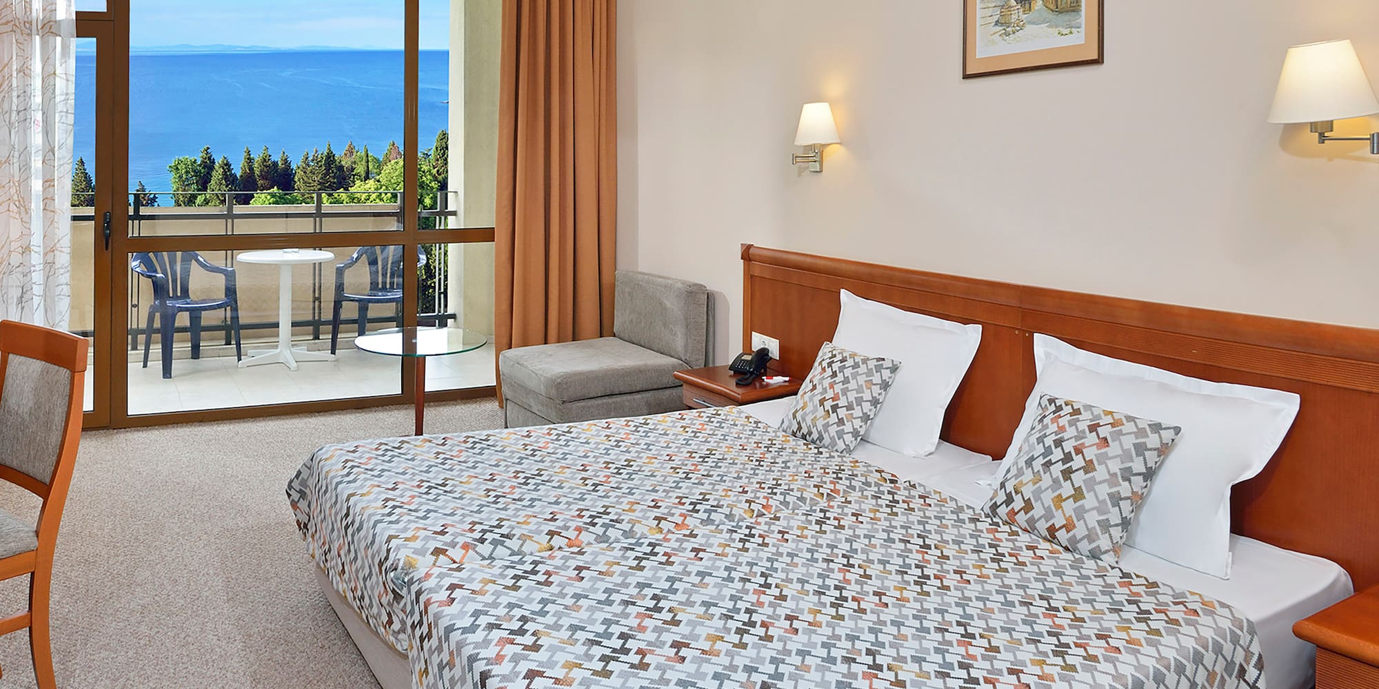 a bedroom with a bed and a glass door