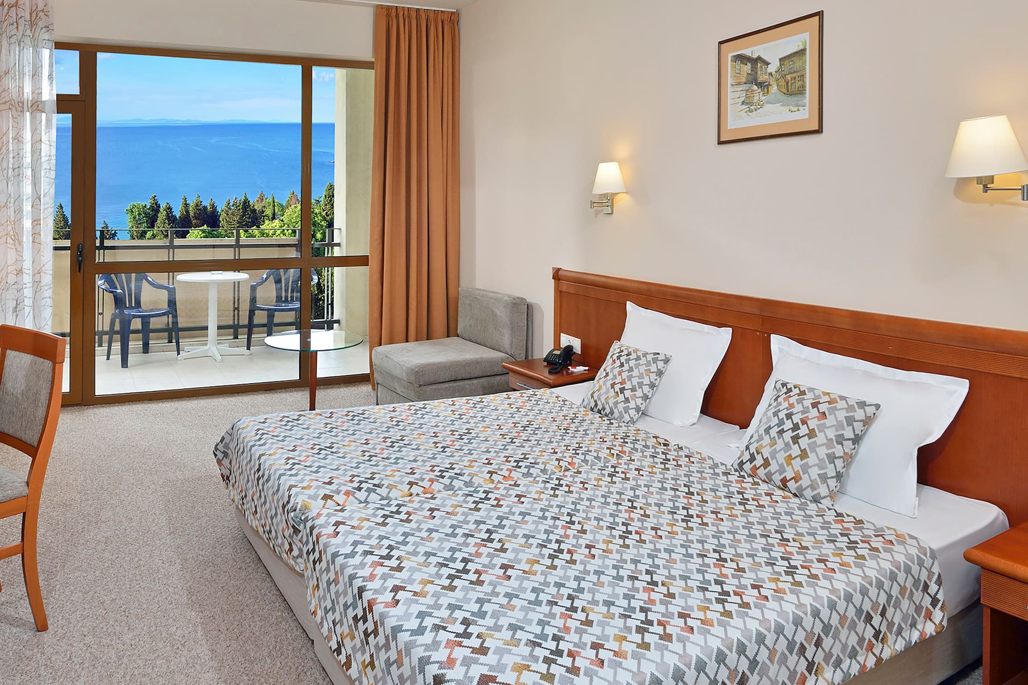 a bedroom with a bed and a glass door