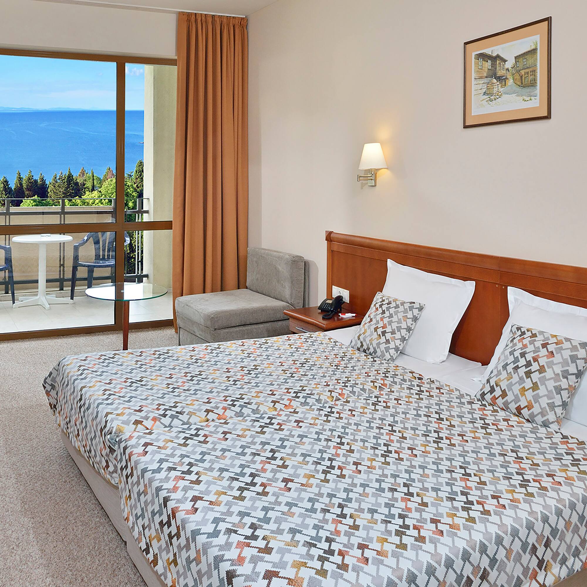 a bedroom with a bed and a glass door