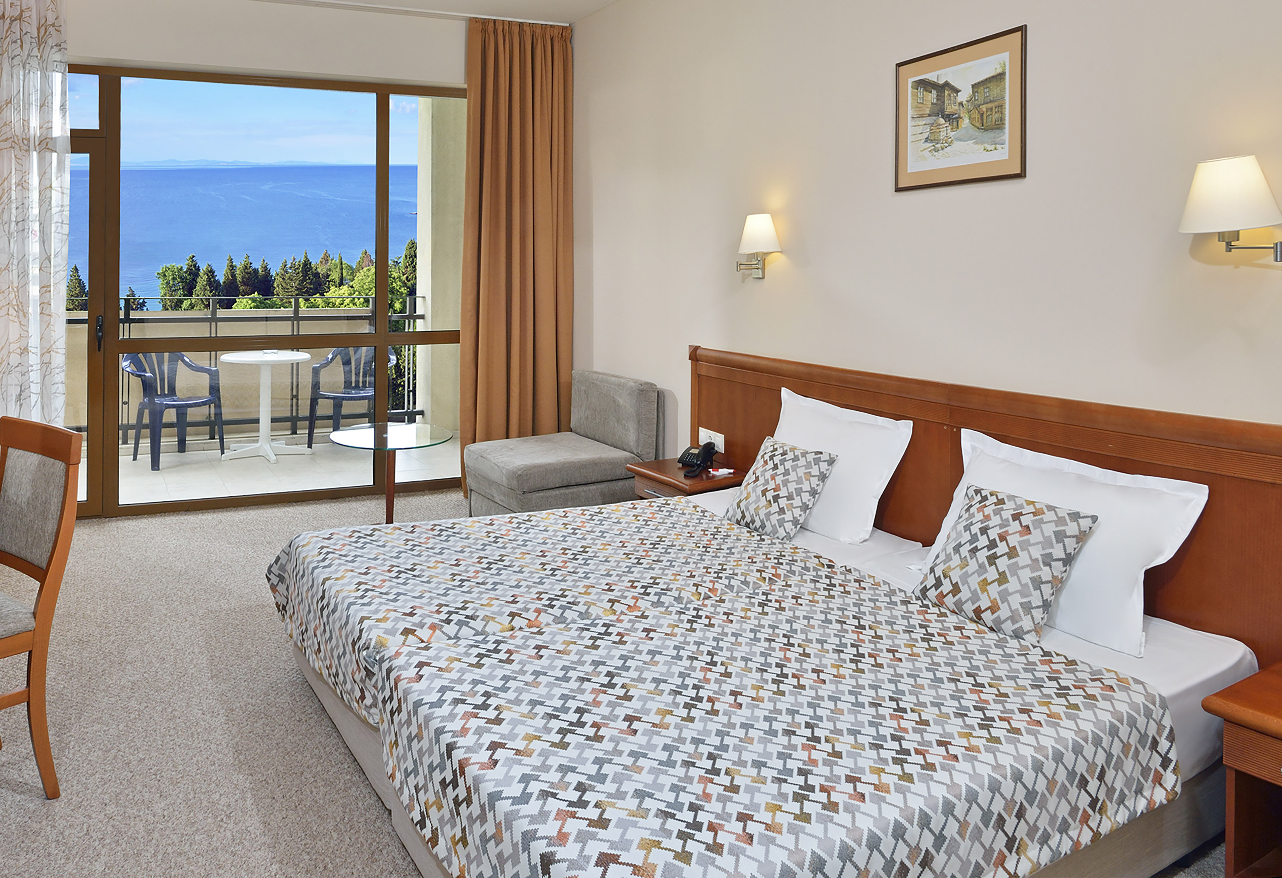 a bedroom with a bed and a glass door