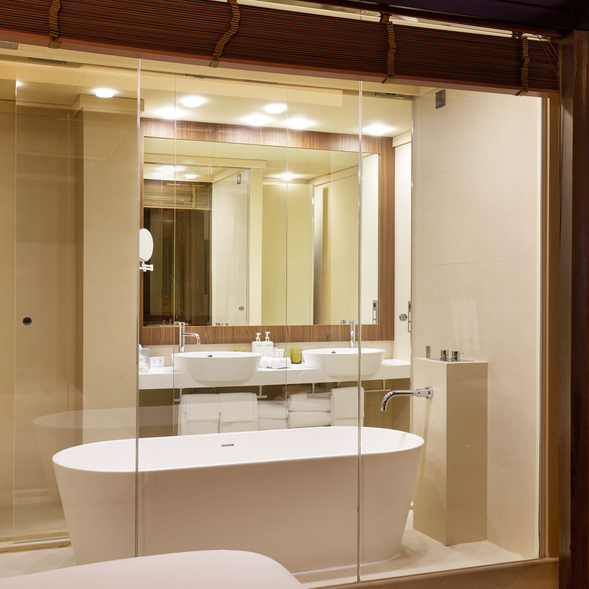 a bathroom with a tub and a mirror
