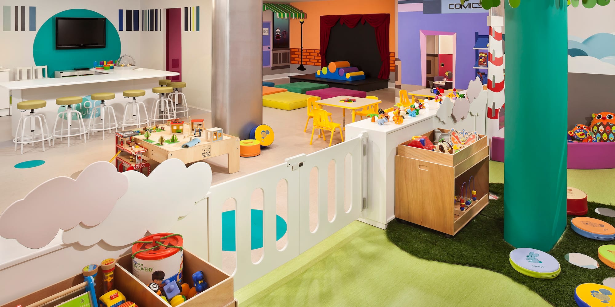 a room with a playroom and a play area