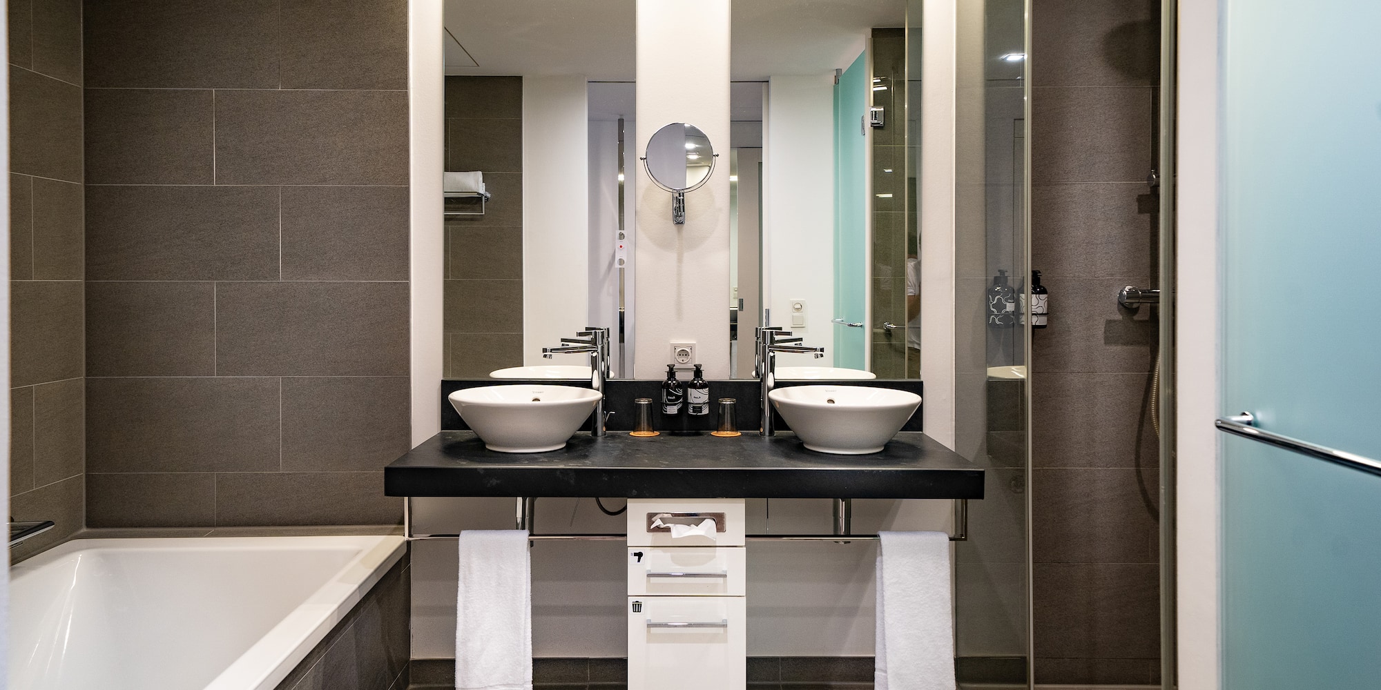 a bathroom with a shower and sink