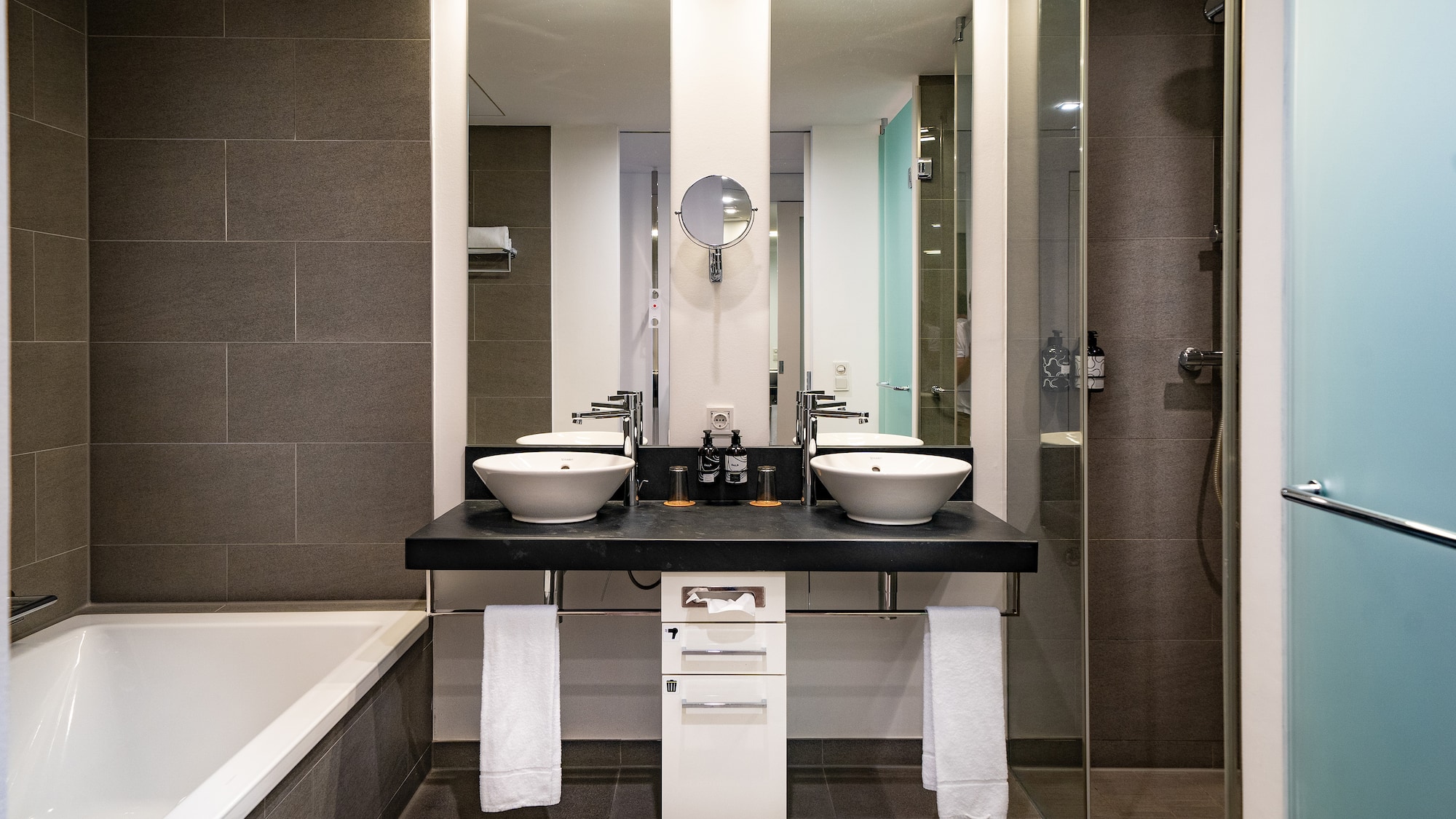 a bathroom with a shower and sink