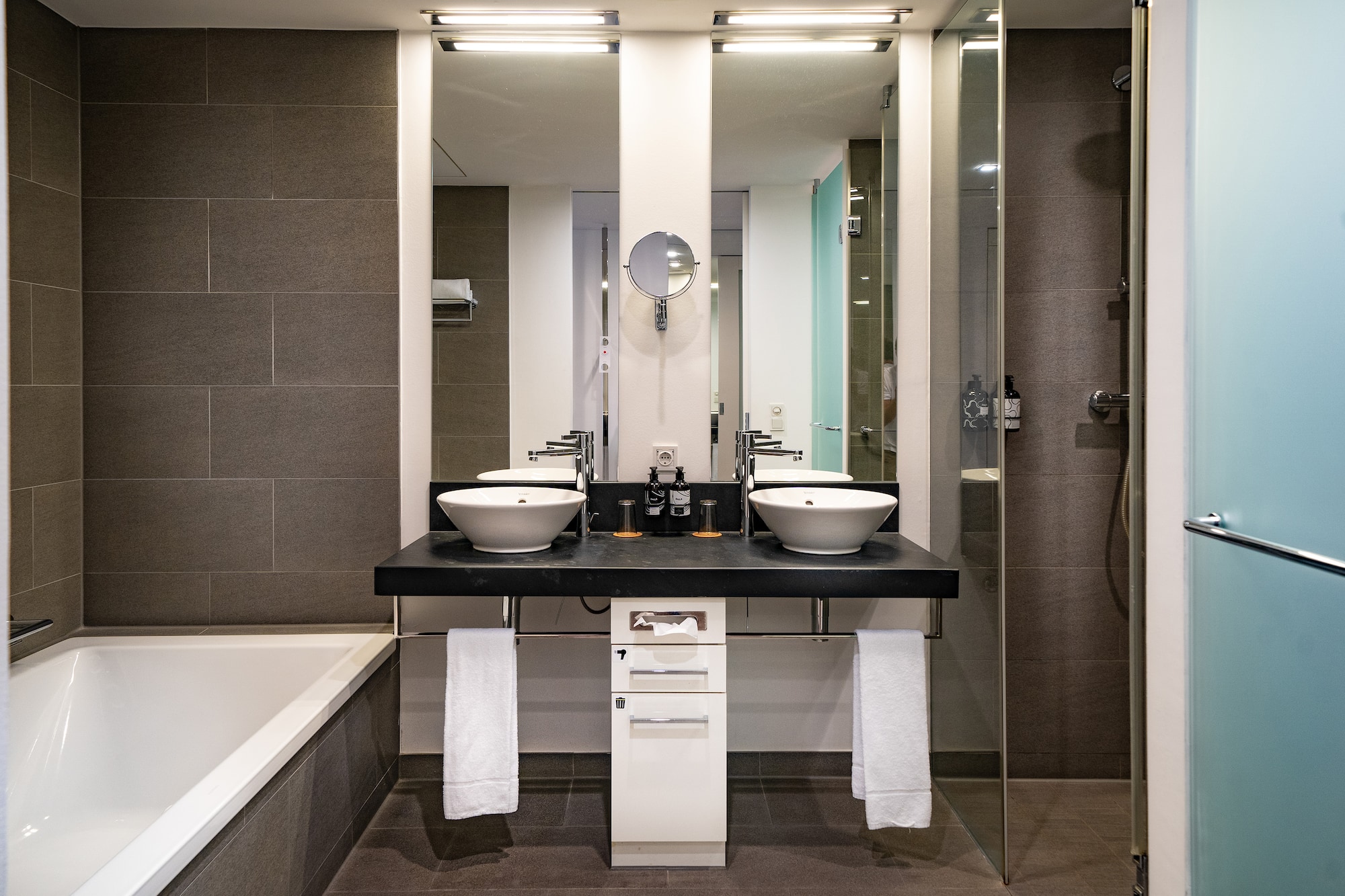 a bathroom with a shower and sink