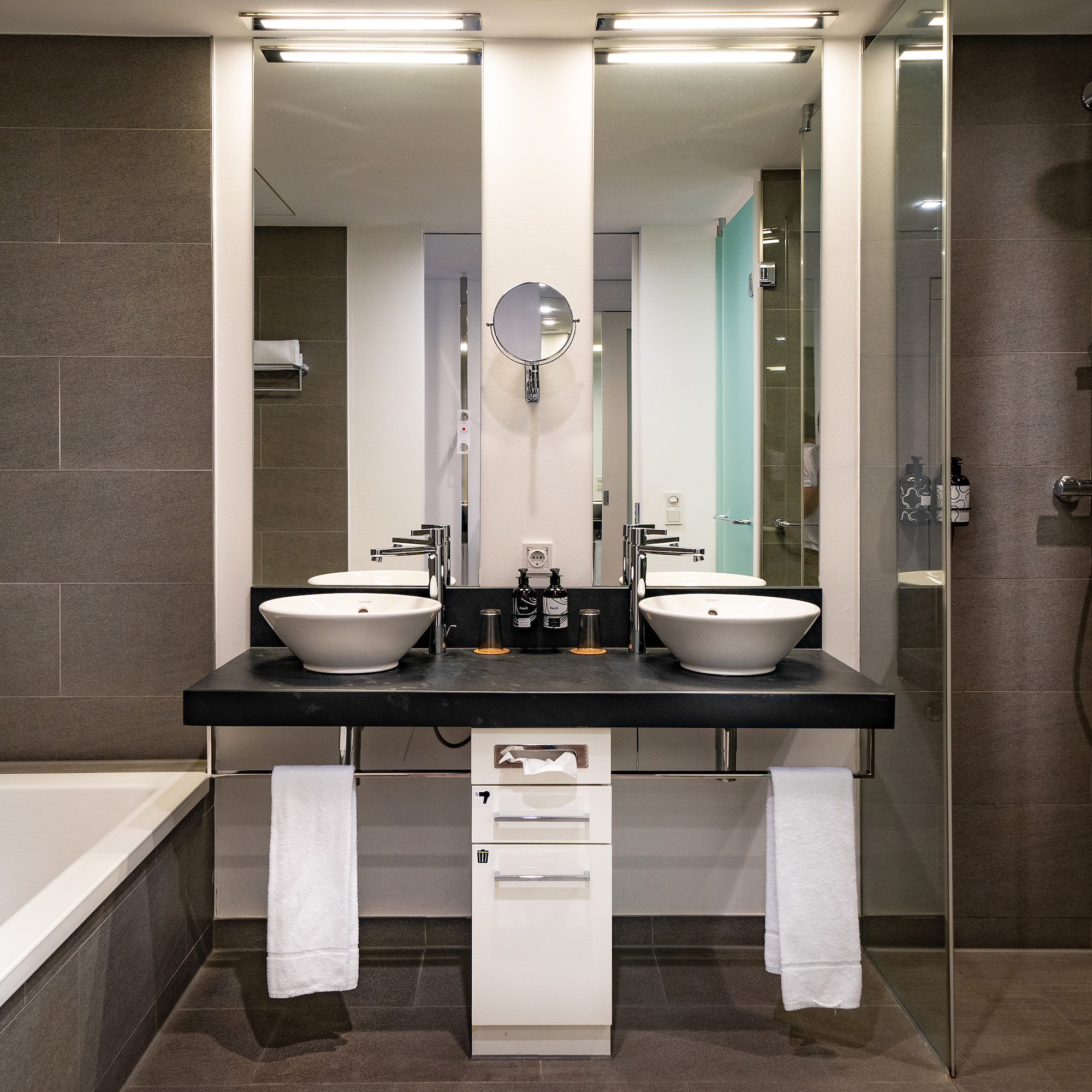 a bathroom with a shower and sink