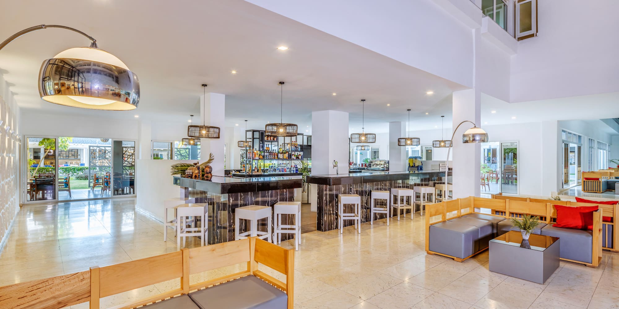 a large room with a bar and a large window