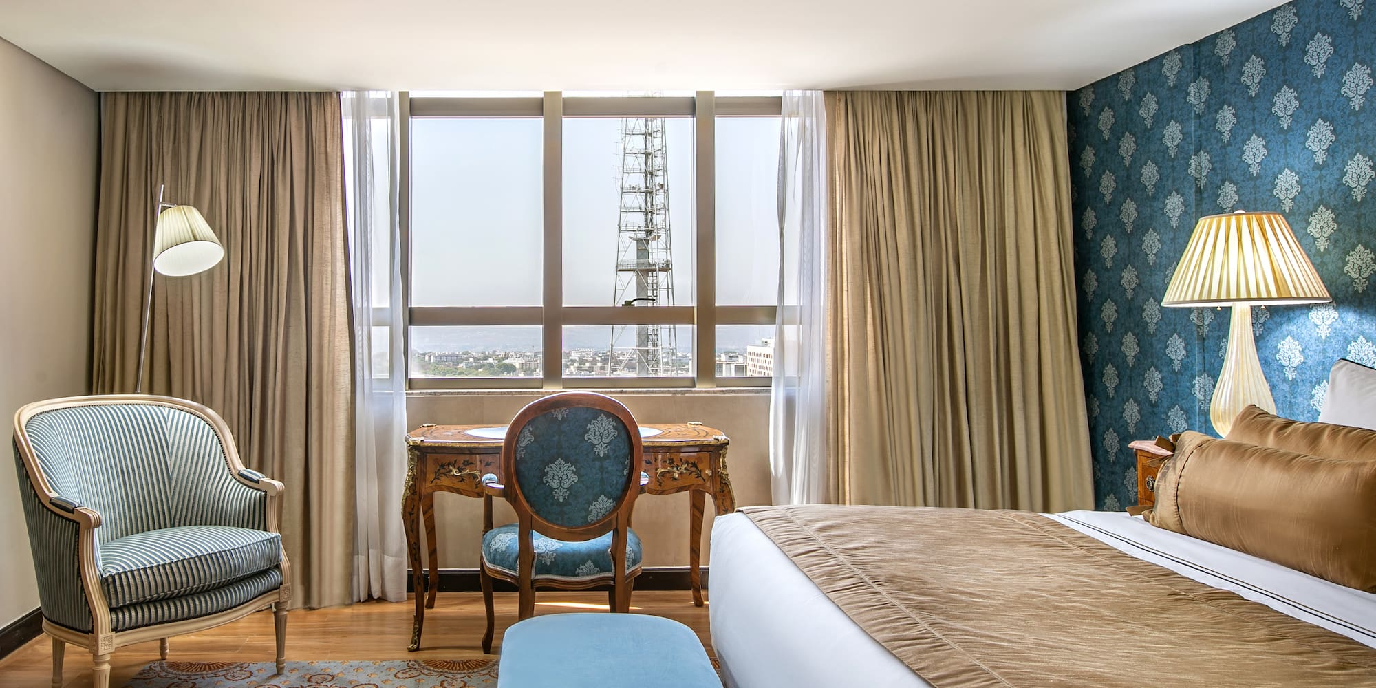 a room with a bed and a chair