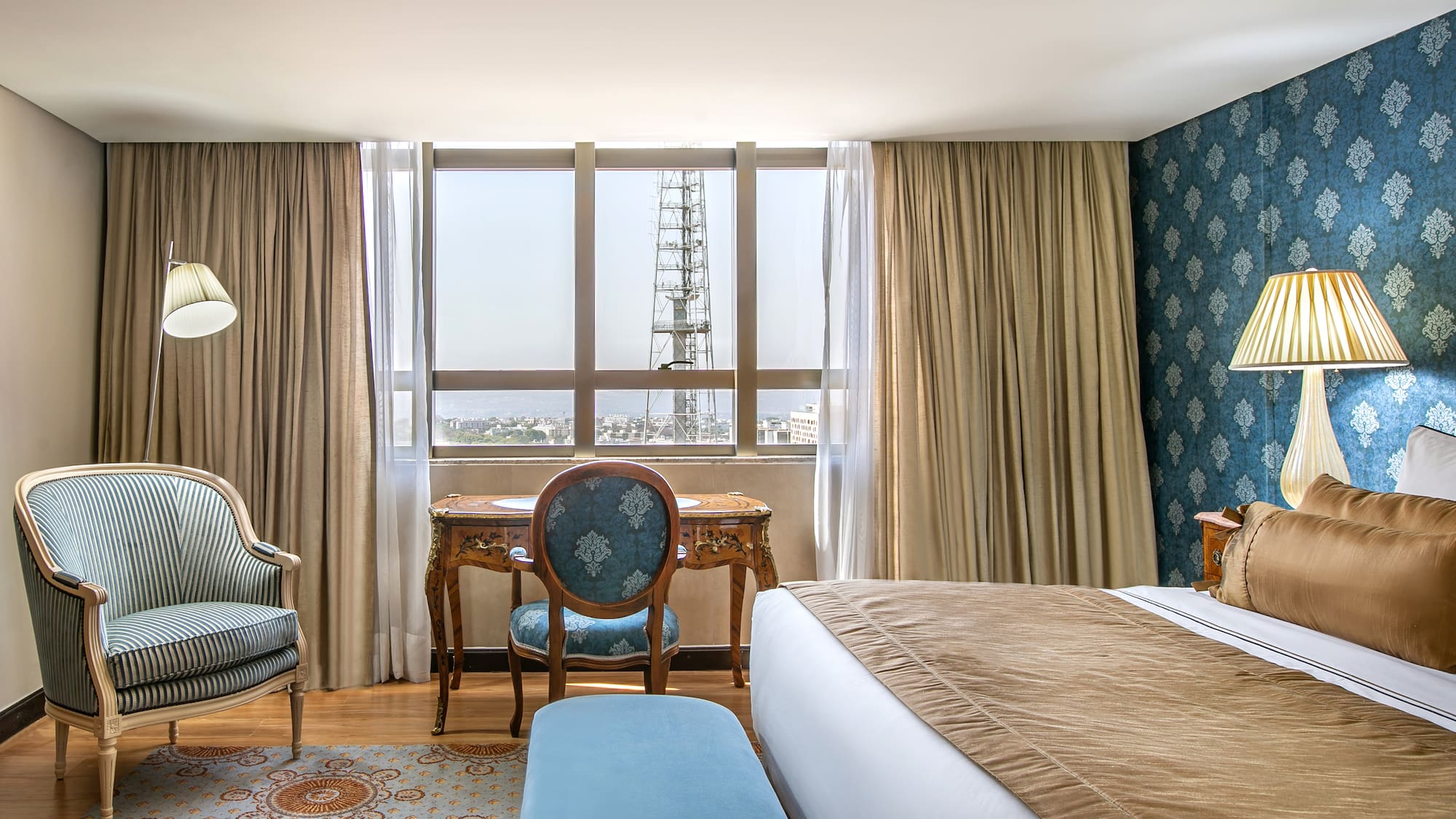 a room with a bed and a chair