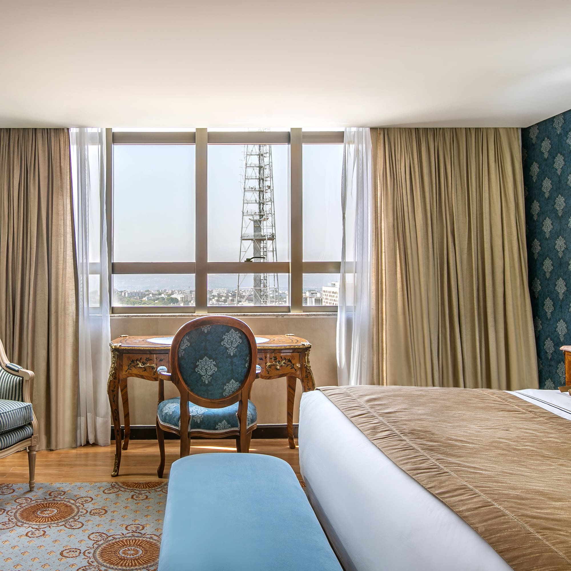 a room with a bed and a chair