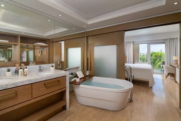 a bathroom with a tub and sink