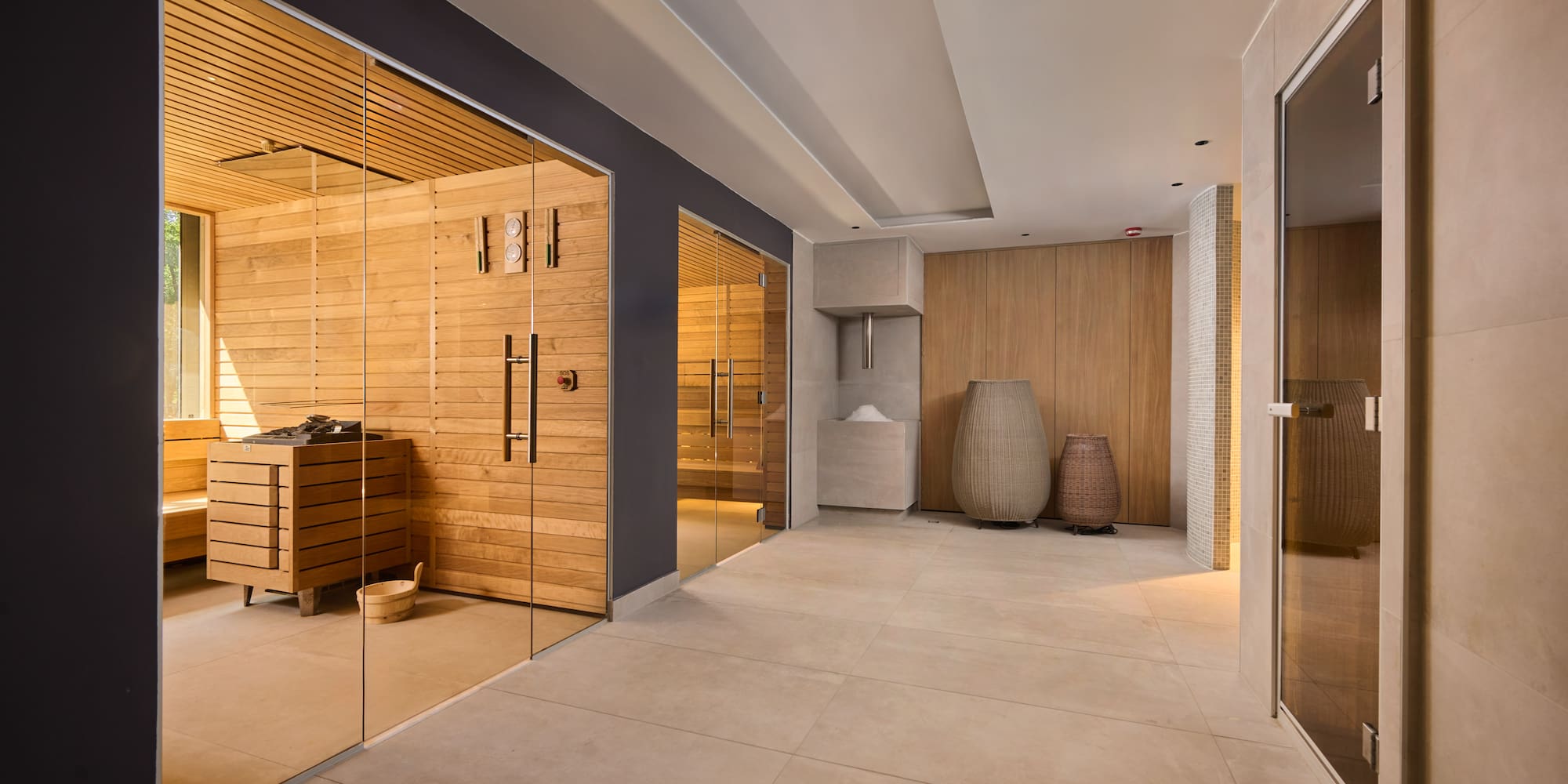 a room with glass doors and a sauna