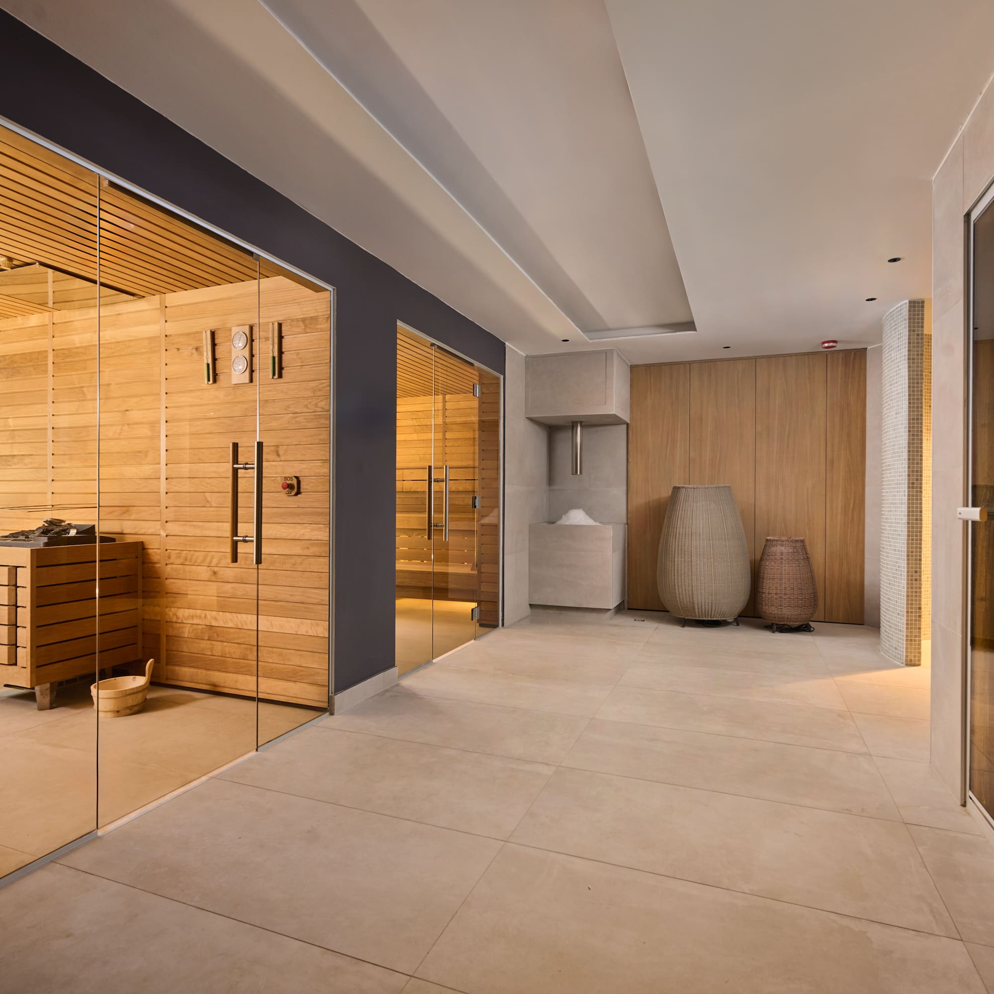 a room with glass doors and a sauna