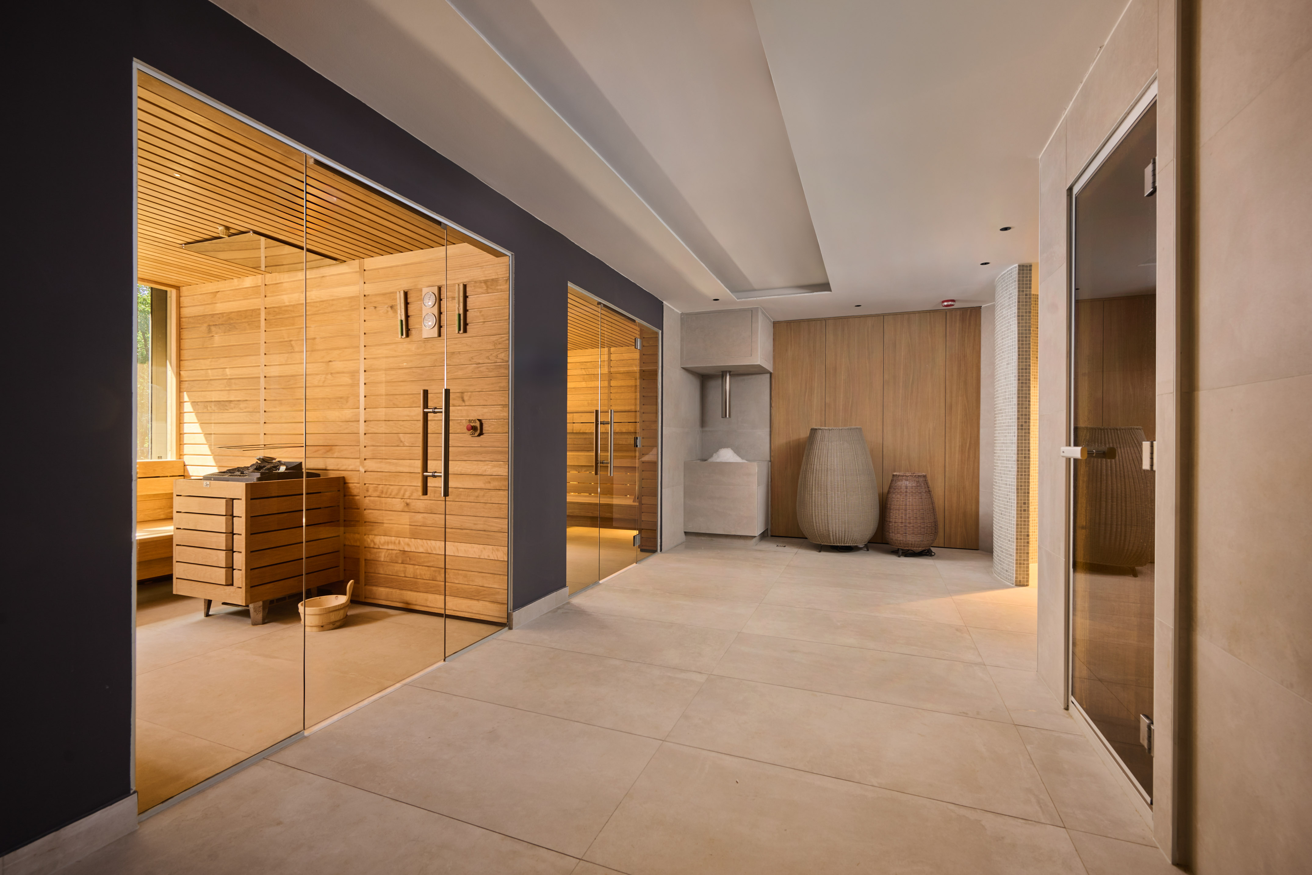a room with glass doors and a sauna