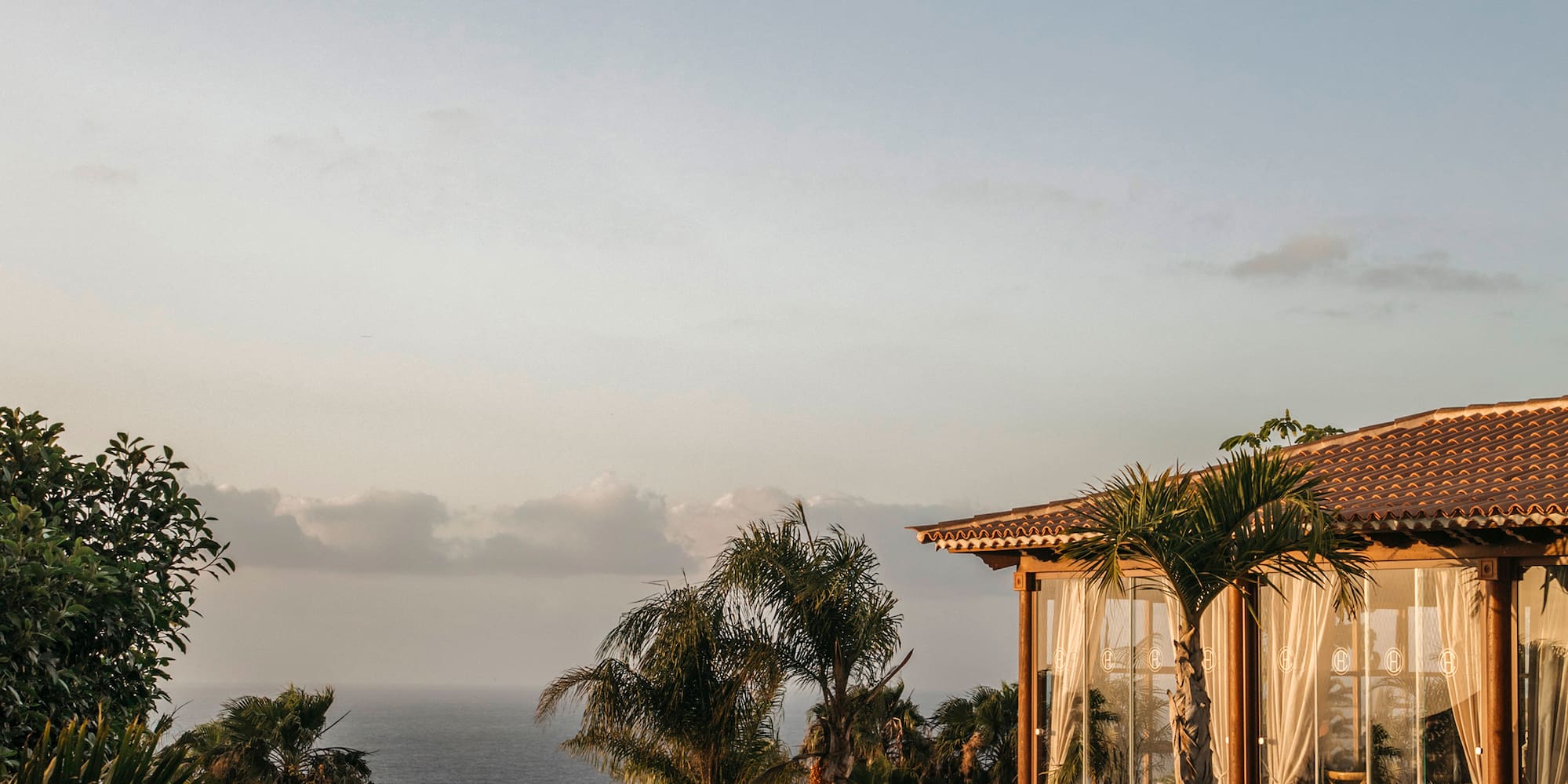 a pool with a building and trees