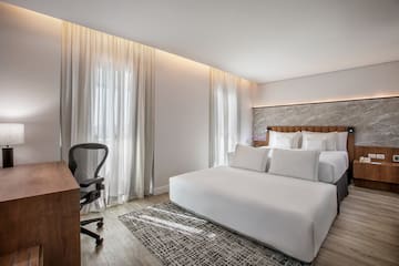 a room with a bed and a desk
