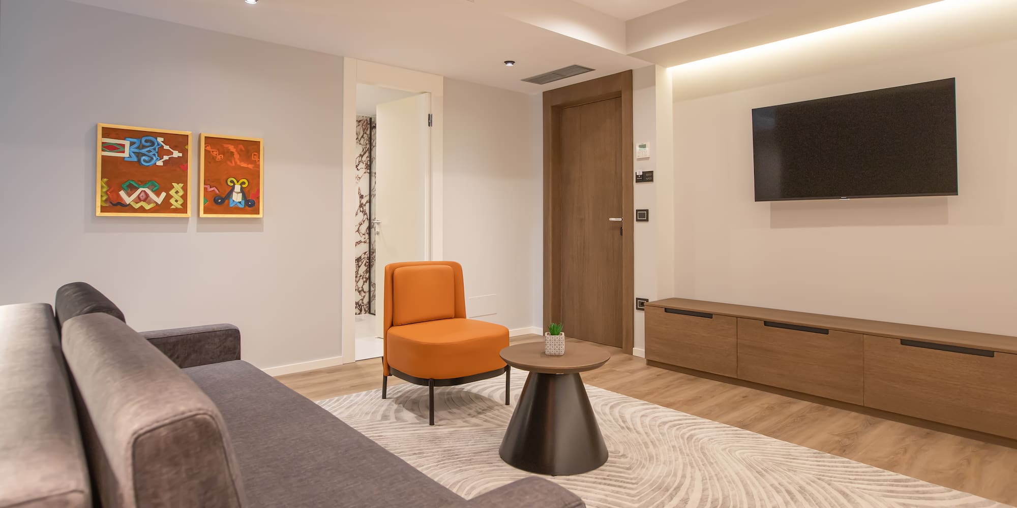 a living room with a couch and a tv