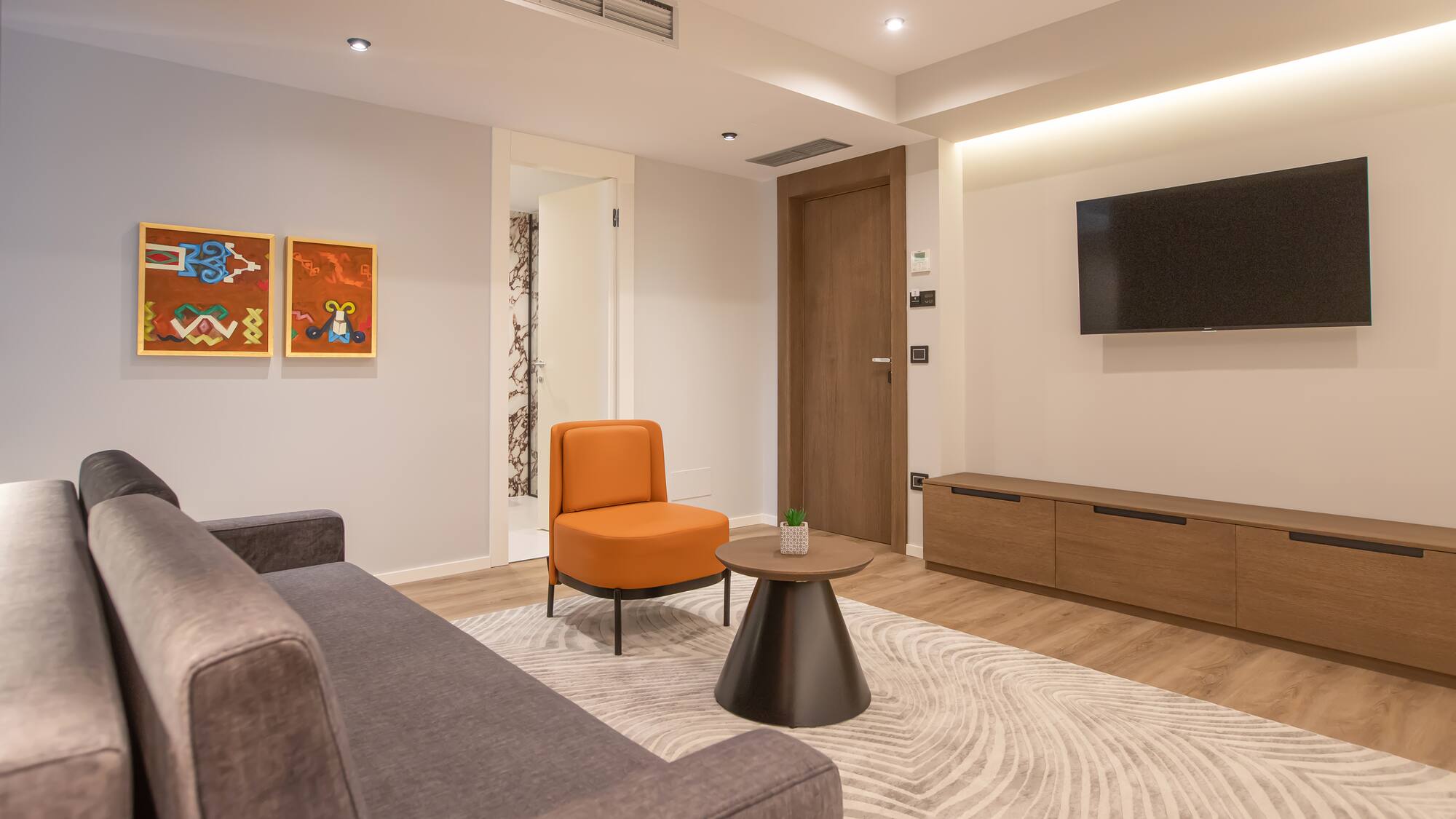 a living room with a couch and a tv