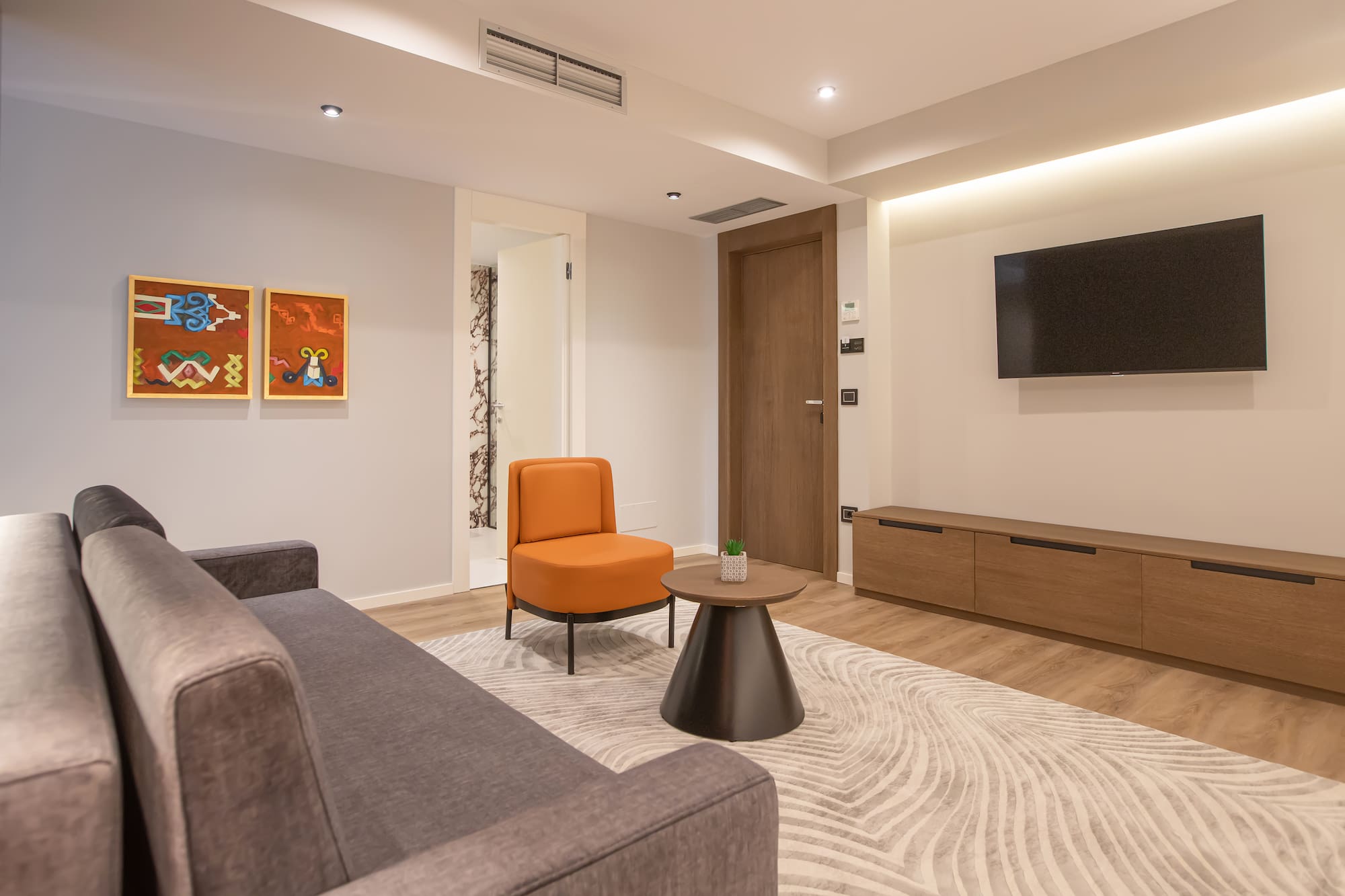 a living room with a couch and a tv