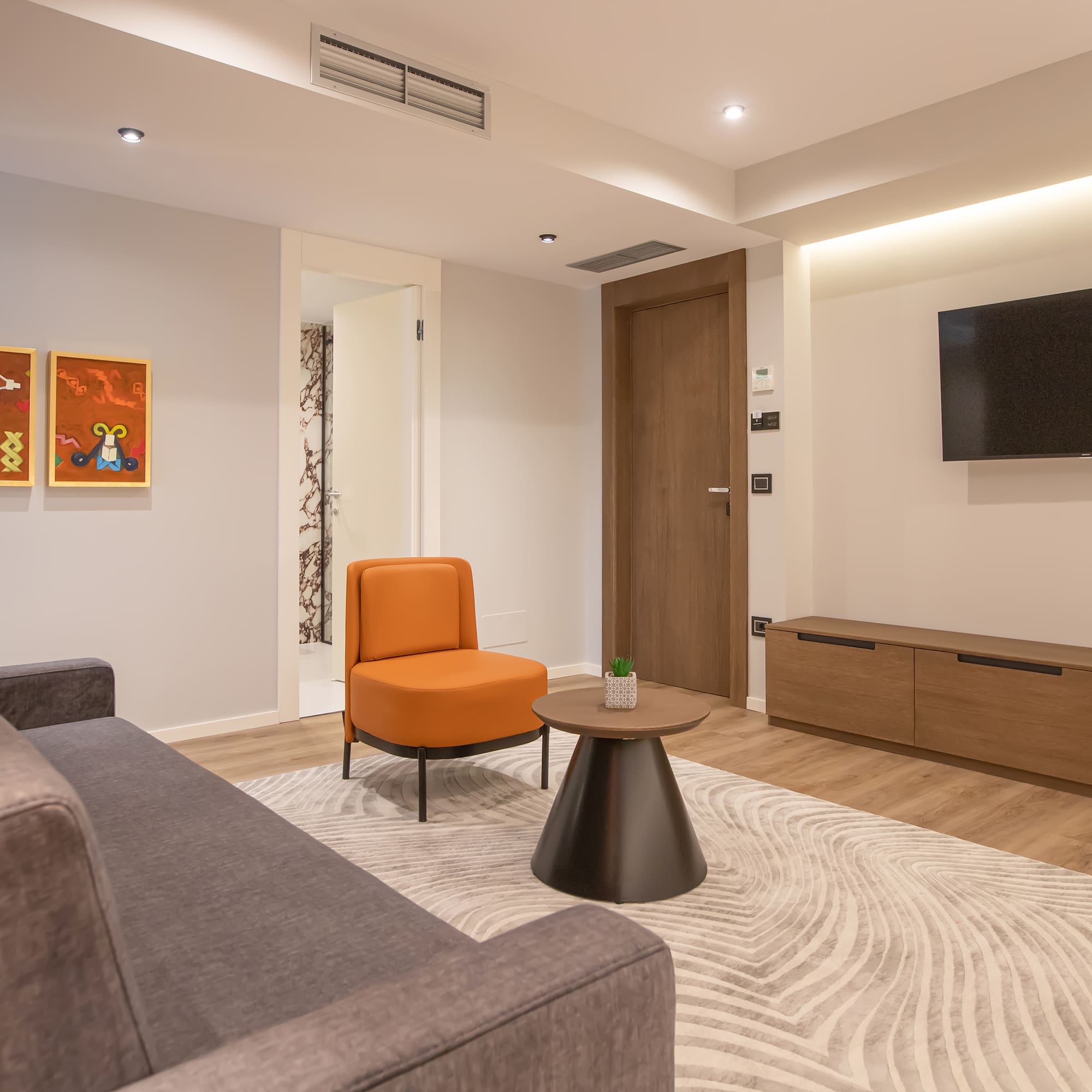 a living room with a couch and a tv