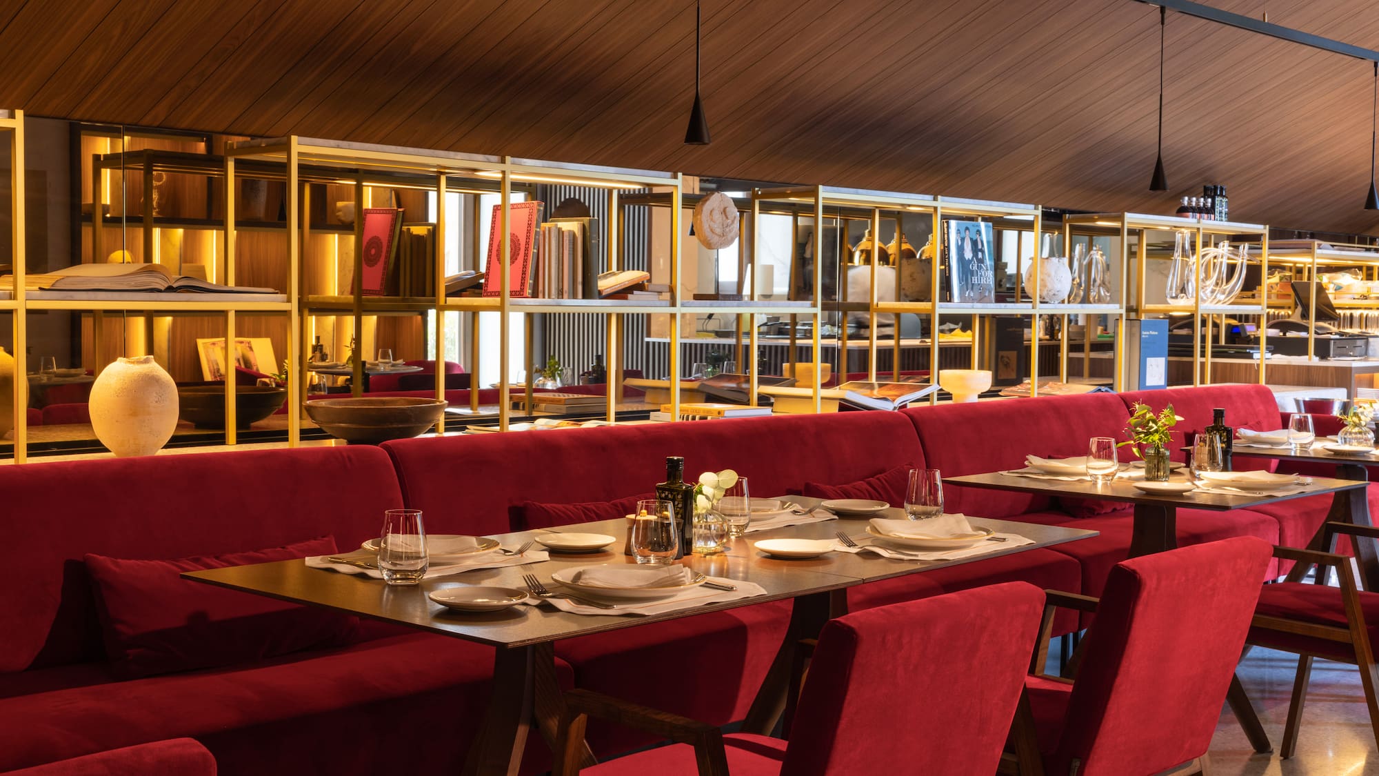 a restaurant with red chairs and tables