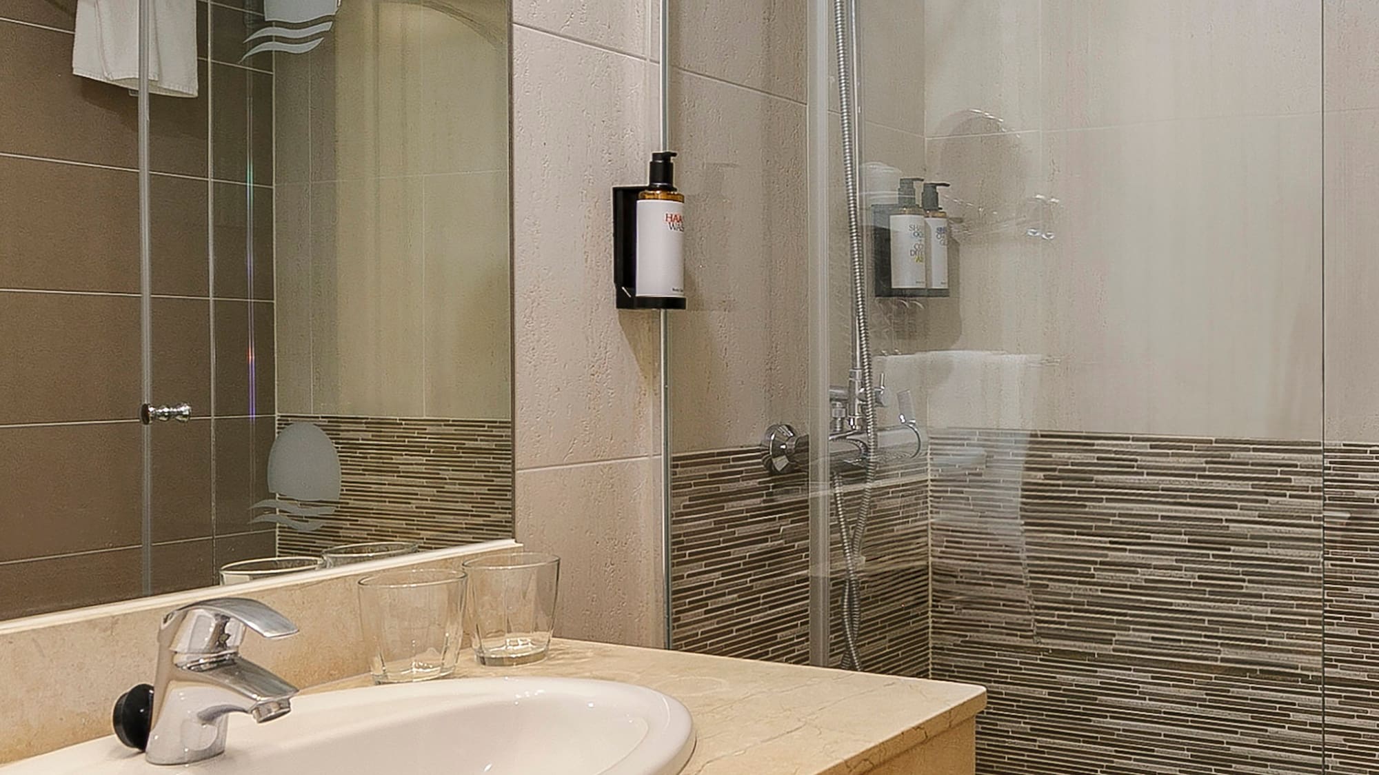 a bathroom with a shower and sink