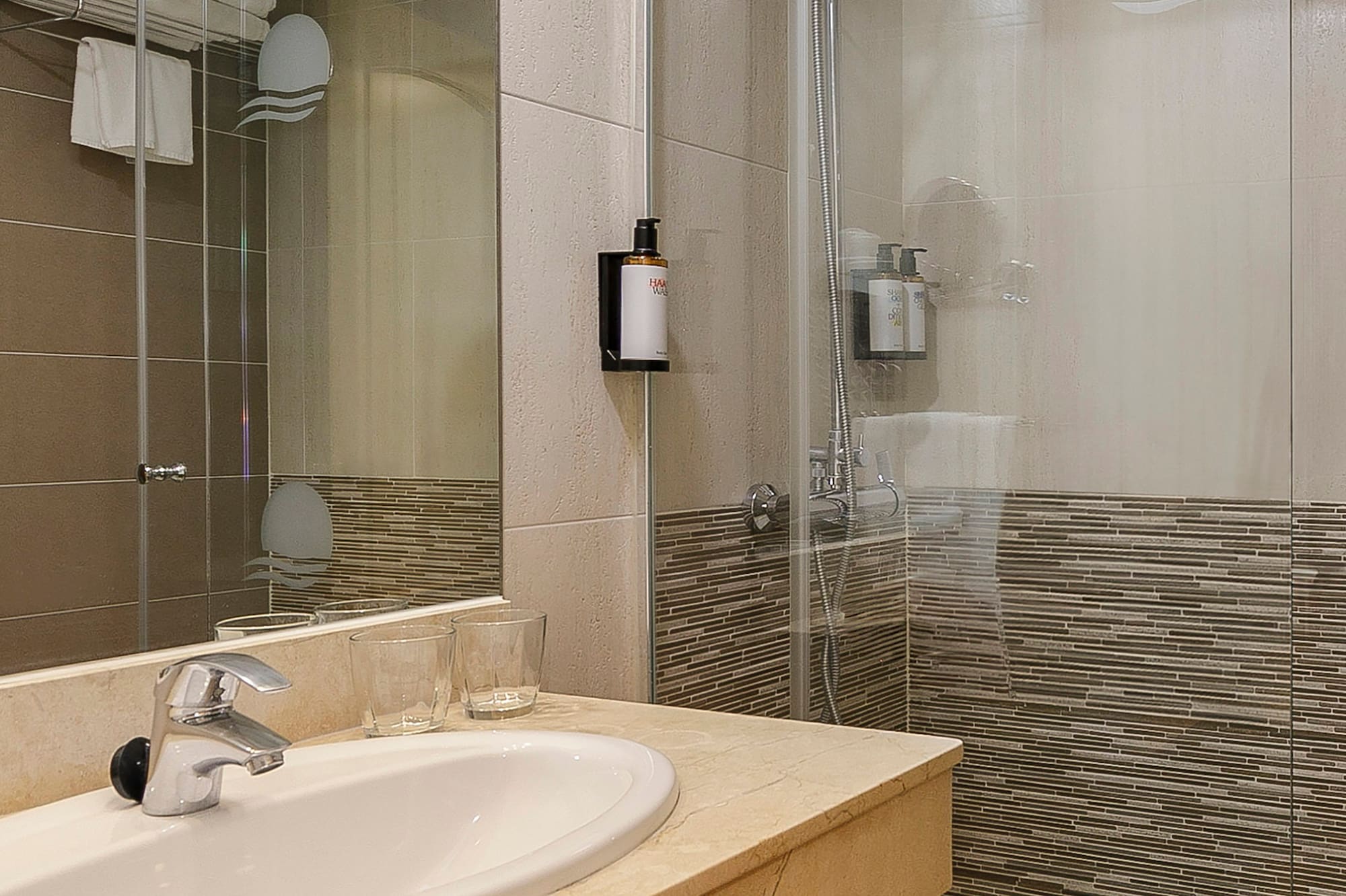 a bathroom with a shower and sink