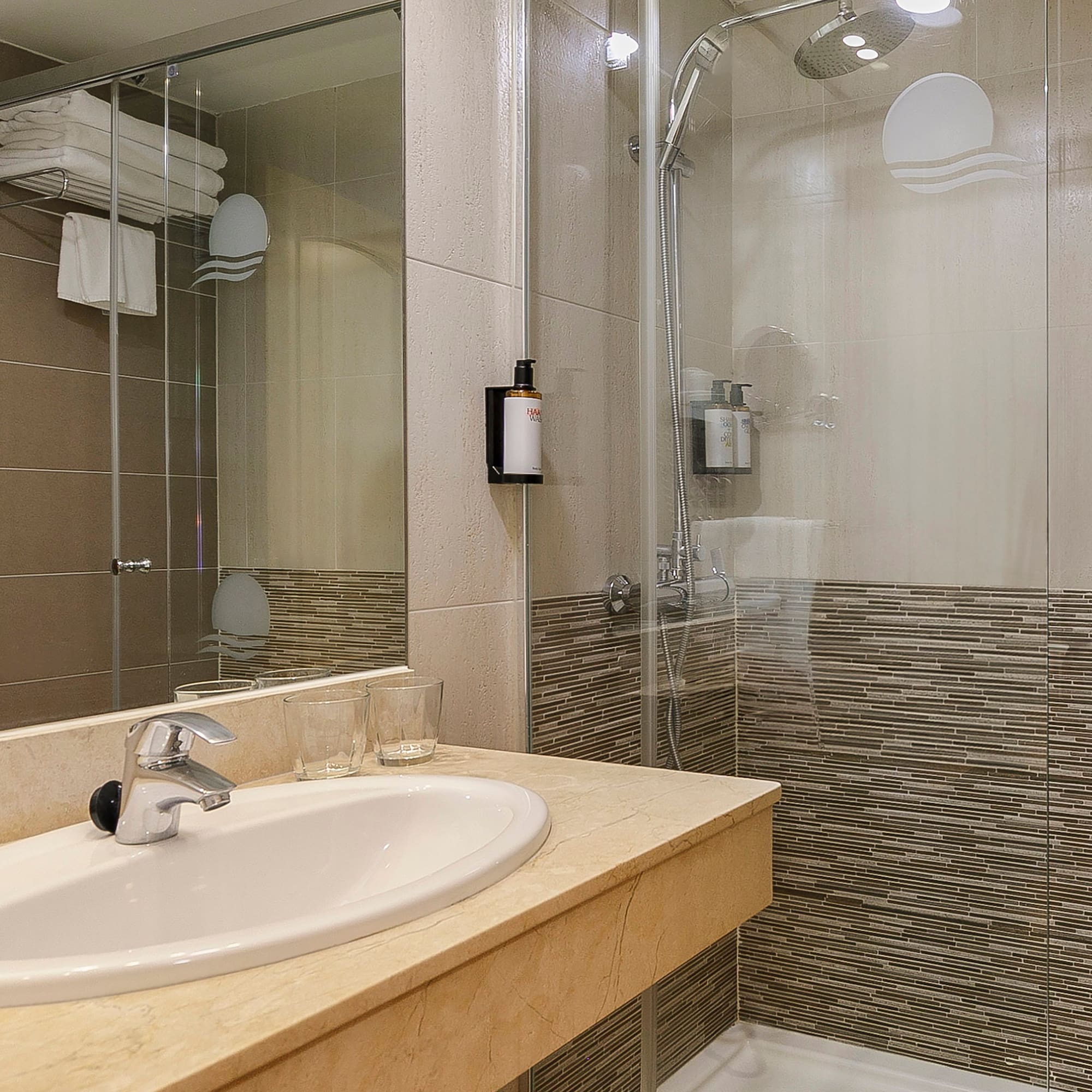 a bathroom with a shower and sink