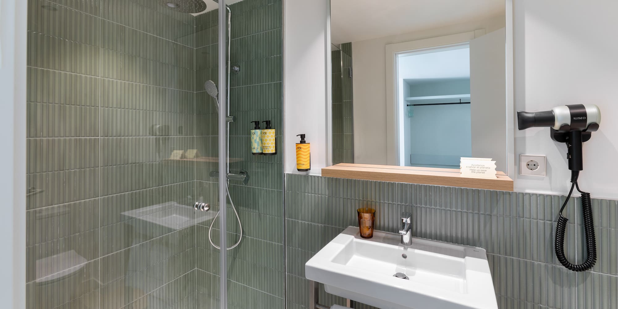 a bathroom with a shower and sink