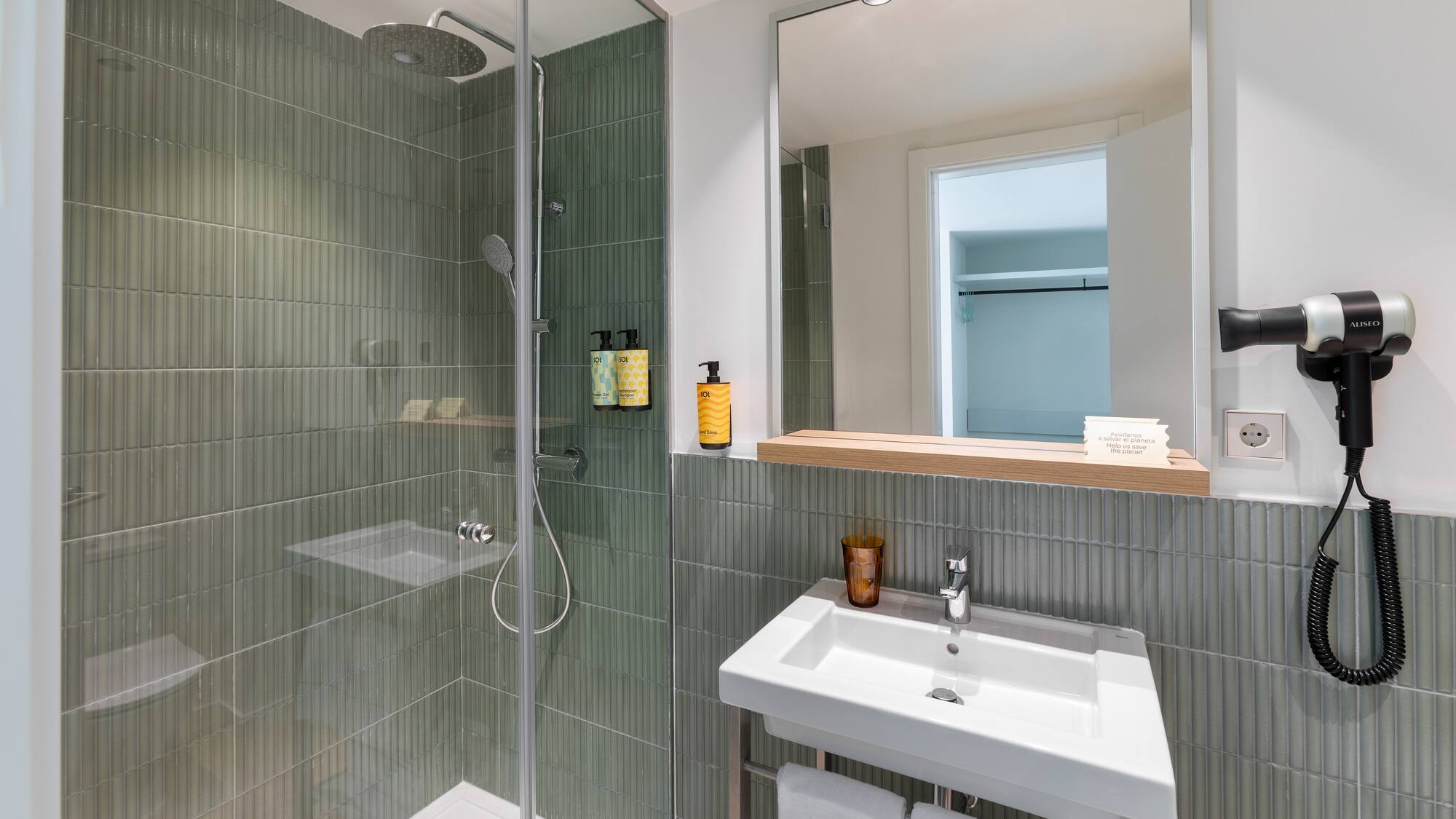 a bathroom with a shower and sink