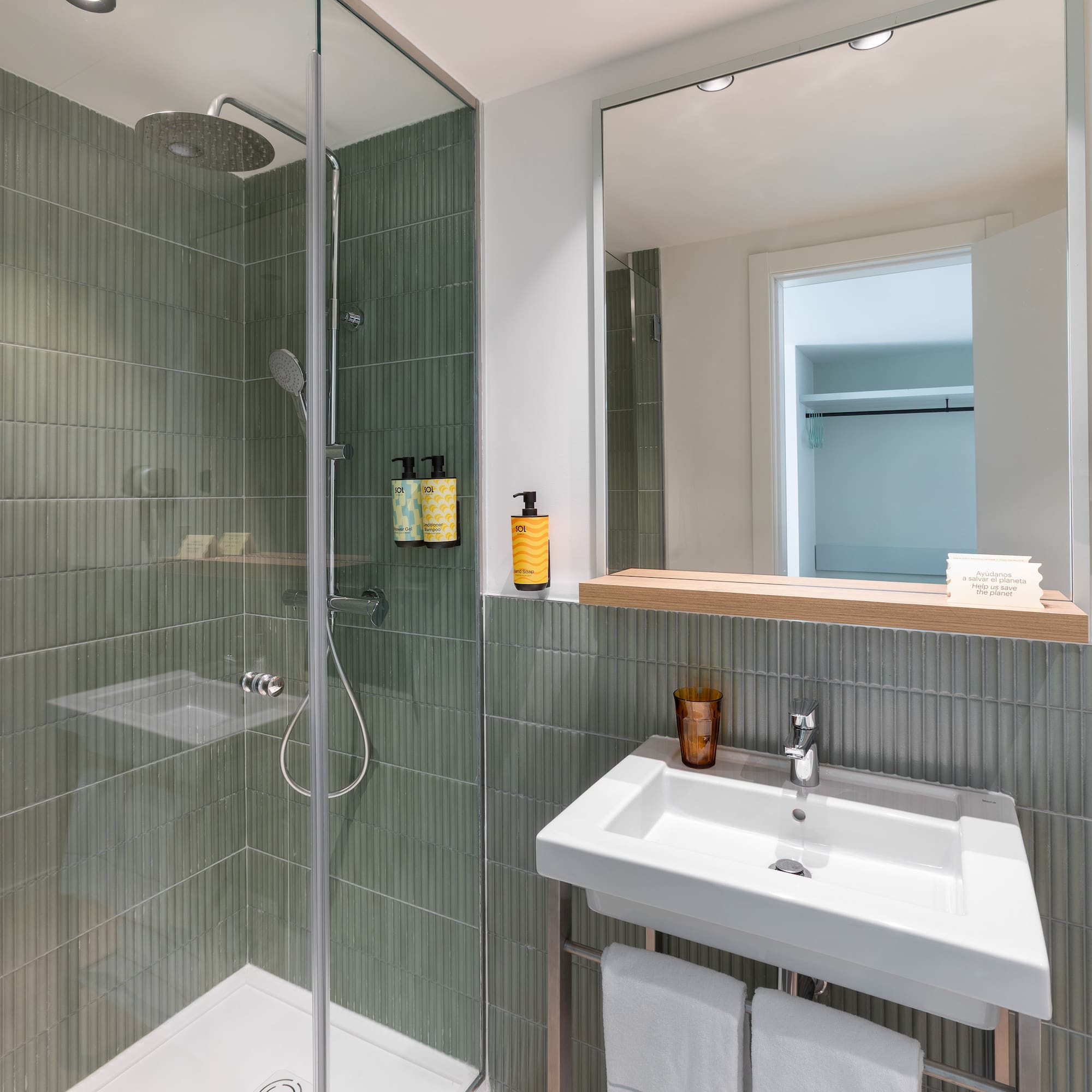 a bathroom with a shower and sink