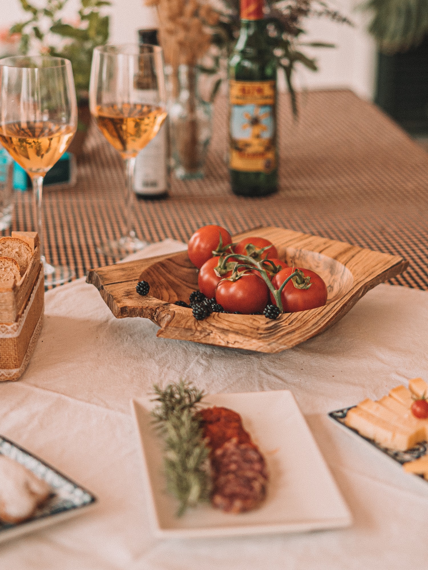a table with food and wine glasses