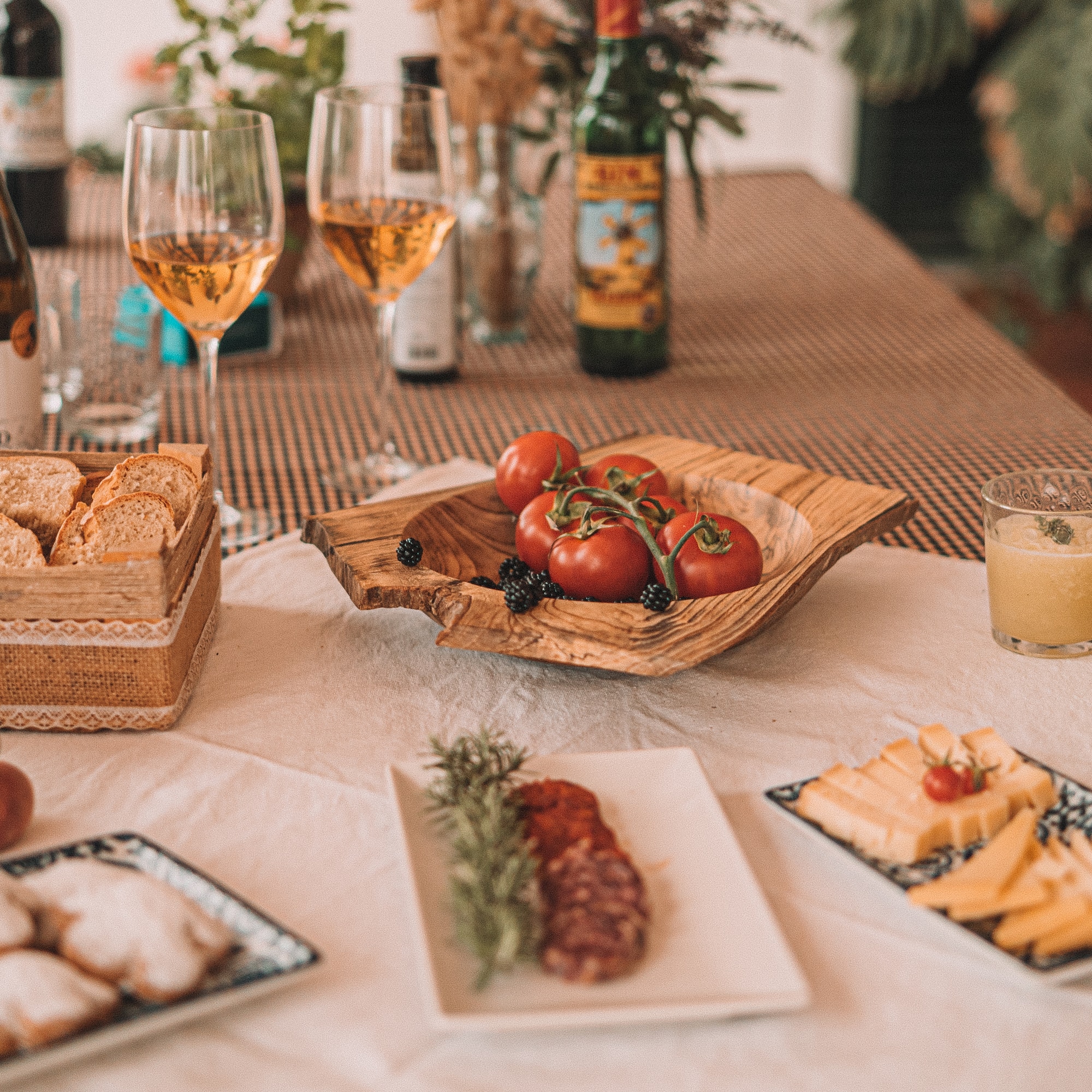 a table with food and wine glasses